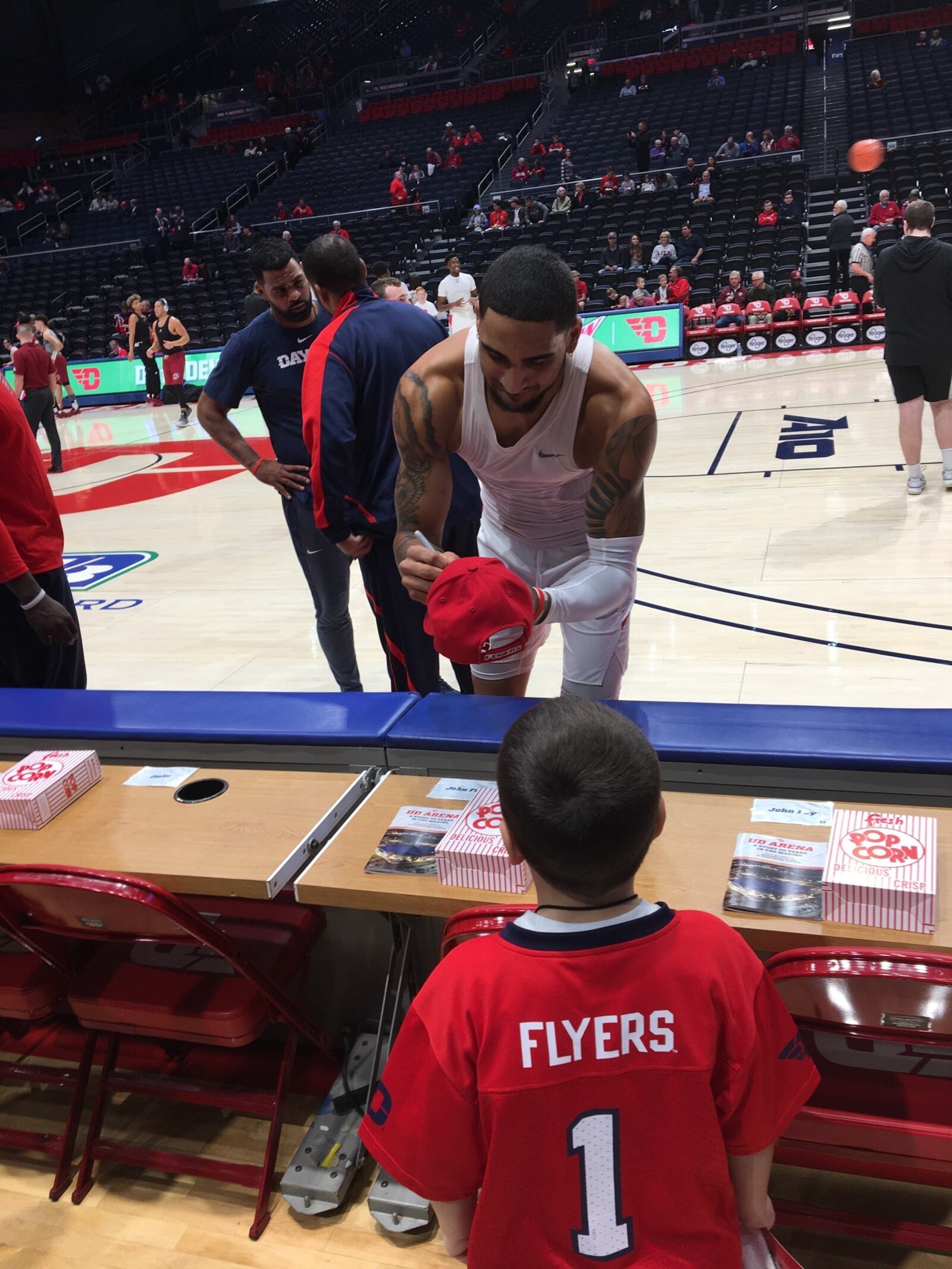 Mason Stall, Eileen and Paul’s great grandson and an avid Flyers fan himself, gets an autograph from Obi Toppin before a game. CONTRIBUTED