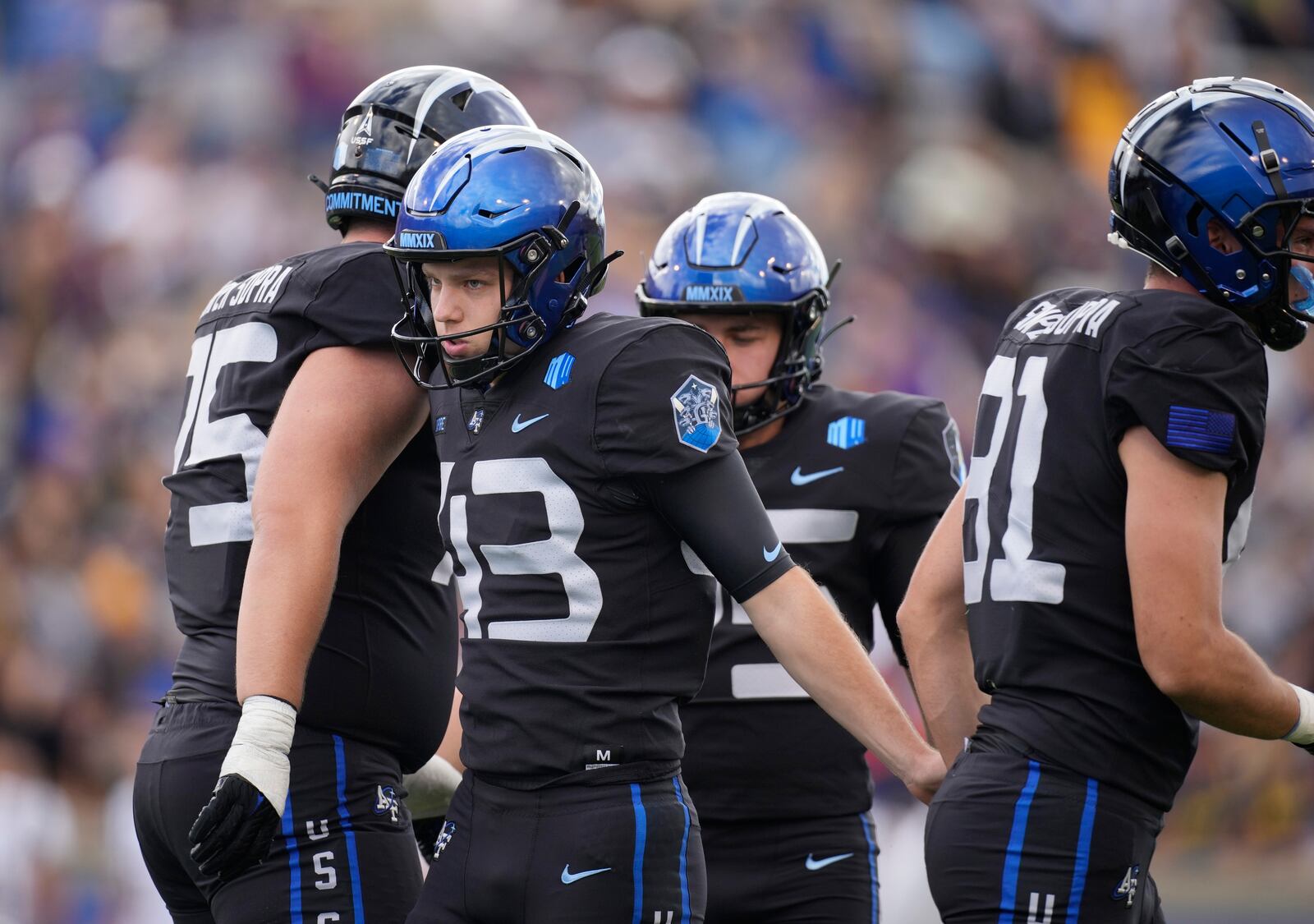 Air Force place kicker Matthew Dapore, center, is congratulated after kicking a field goal against Navy in the second half of an NCAA college football game Saturday, Oct. 1, 2022, at Air Force Academy, Colo. (AP Photo/David Zalubowski)