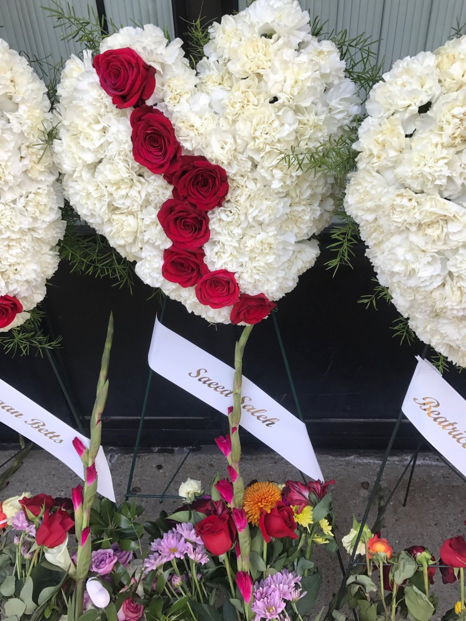 Memorial wreath for Saeed Saleh placed along Fifth Street in the Oregon District near where Saeed was killed early Sunday morning. TOM ARCHDEACON/STAFF