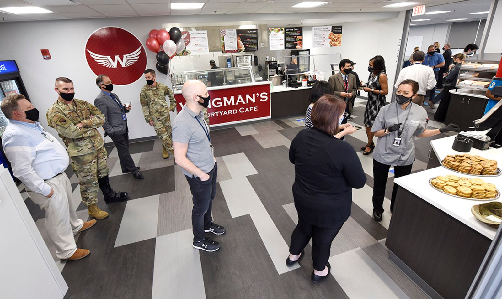 Military and civilian personnel fill the newly opened Wingman’s Courtyard Café after a ribbon-cutting ceremony April 6 inside the Sensors Directorate on Area B at Wright-Patterson Air Force Base. U.S. AIR FORCE PHOTO/TY GREENLEES