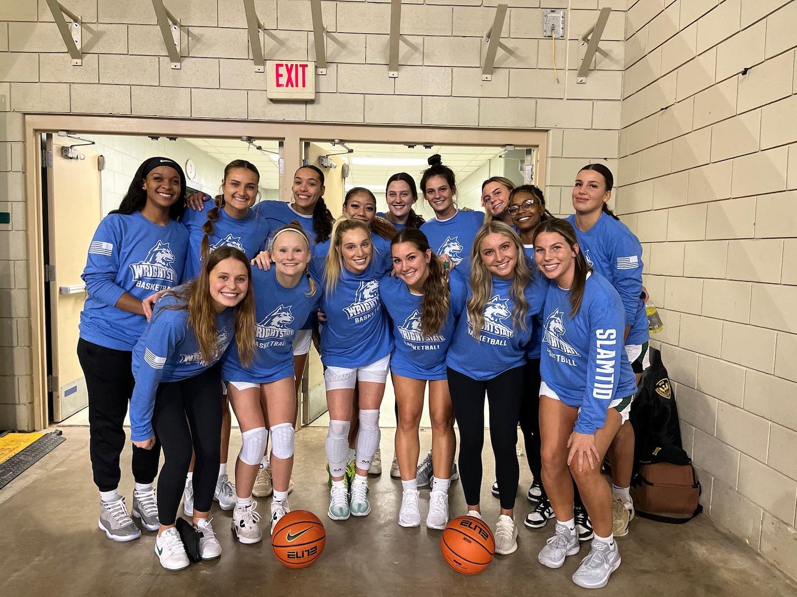 Ellie Magestro Kennedy (front row left) and her Wright State teammates wearing their blue SLAMT1D shirts to help promote awareness of Type I Diabetes at the Raiders game with Slippery Rock on Monday night at the Nutter Center. WSU won 82-45. Alex Underwood/Wright State Athletics photo