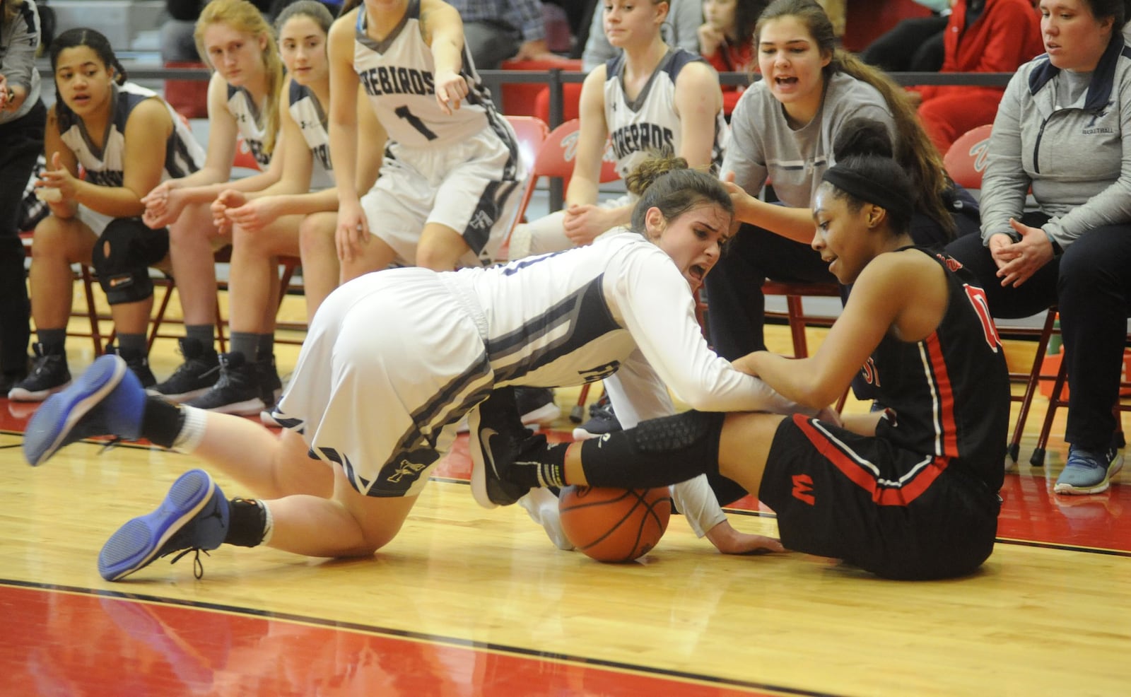 Mali Morgan-Elliott of Fairmont (left) battles Jaydis Gales. Lakota West defeated Fairmont 53-29 in a girls high school basketball D-I district final at Princeton on Sat., March 3, 2018. MARC PENDLETON / STAFF