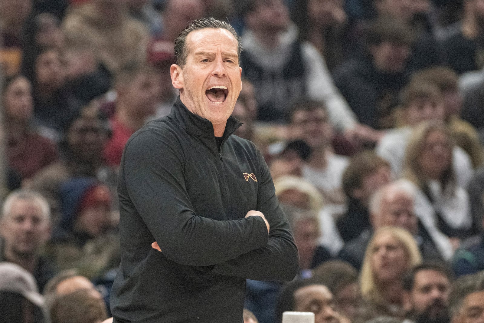 Cleveland Cavaliers head coach Kenny Atkinson shouts instructions to his team during the first half of an NBA basketball game against the Portland Trail Blazers in Cleveland, Sunday, March 2, 2025. (AP Photo/Phil Long)