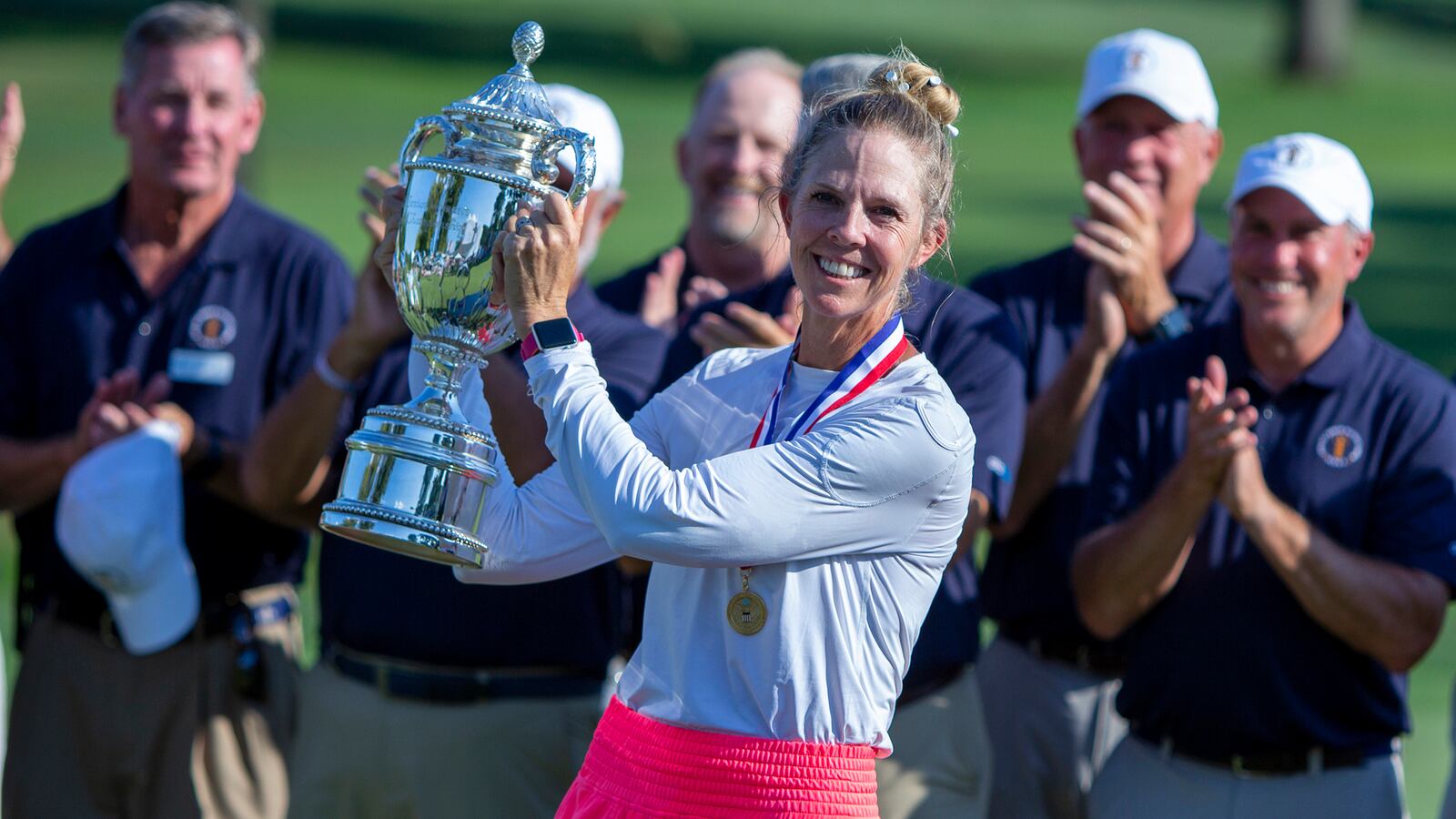 Jill McGill holds her trophy after winning the U.S. Senior Women's Open golf tournament at NCR Country Club in Kettering Aug. 28. It was the first professional win of her career. FILE