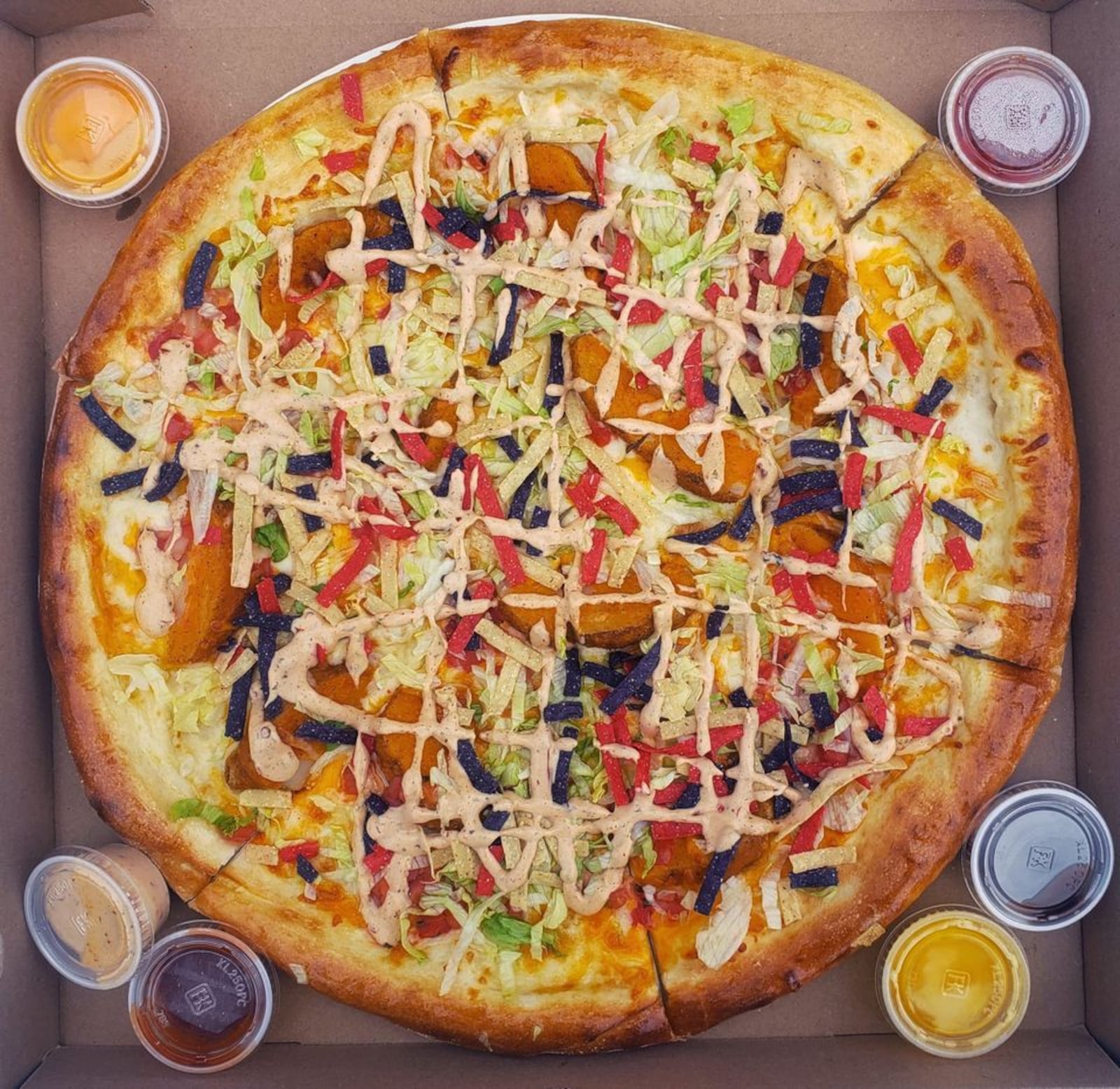 The "Eat Rocks Taco Bell" pizza, available this week at The Pizza Bandit pizza truck, located at Yellow Cab Tavern.