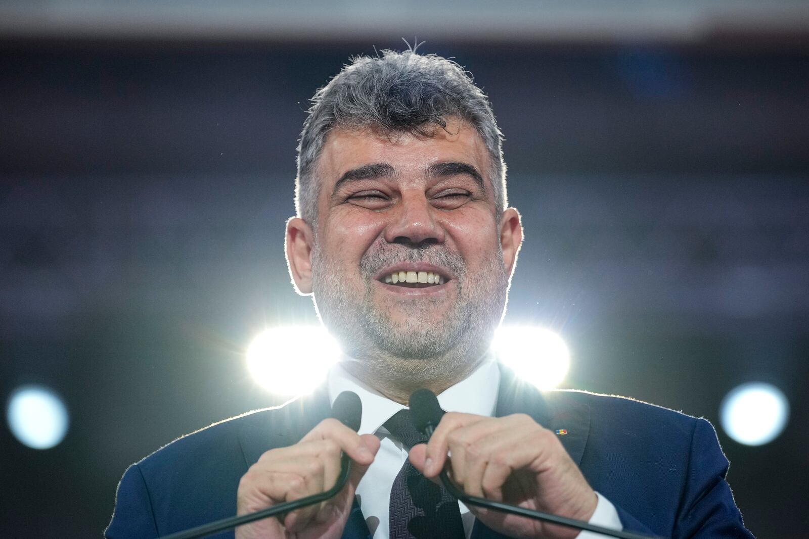 Romanian Prime Minister Marcel Ciolacu addresses delegates at the congress of the Social Democratic Party or PSD, which nominated him as the party's candidate in the upcoming Nov. 24 presidential elections in Bucharest, Romania, Saturday, Aug. 24, 2024. (AP Photo/Andreea Alexandru)