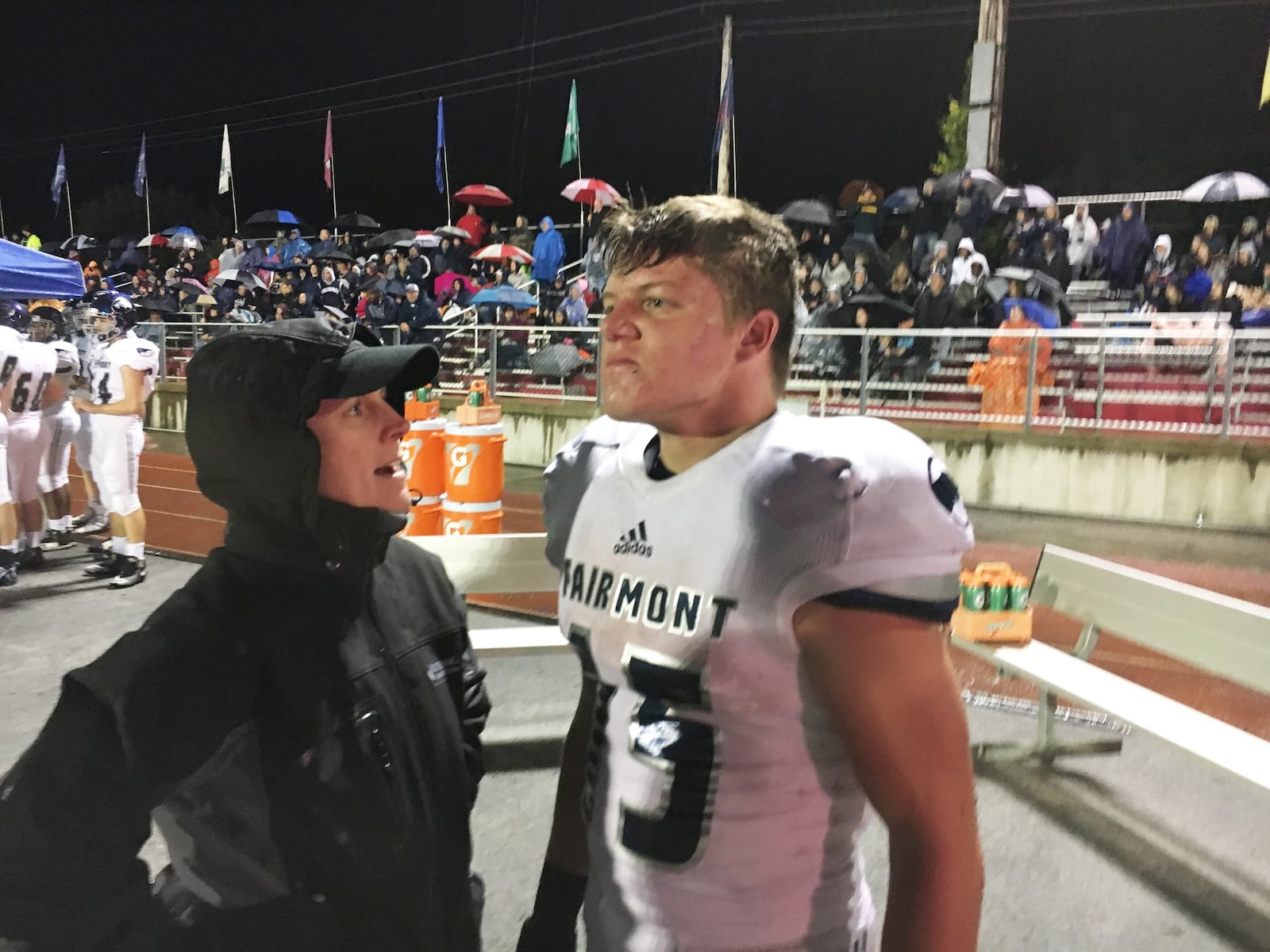 Trainer Robin Lensch checks on Fairmont’s Jesse Deglow. Wayne defeated visiting Fairmont 49-44 in a Week 8 high school football game on Friday, oct. 12, 2018. MARC PENDLETON / STAFF