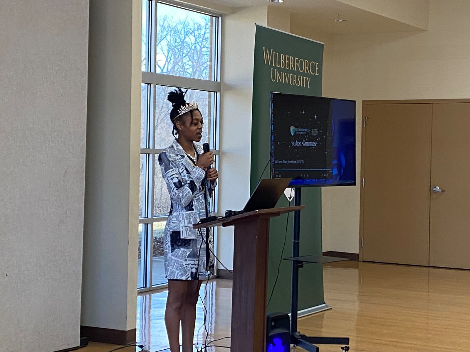 Ambrea Hightower, a Wilberforce student and owner of several small businesses, including a streetwear store, makeup service and a mobile bartending service, speaks during a signing between the Small Business Administration and Wilberforce University. Eileen McClory / Staff