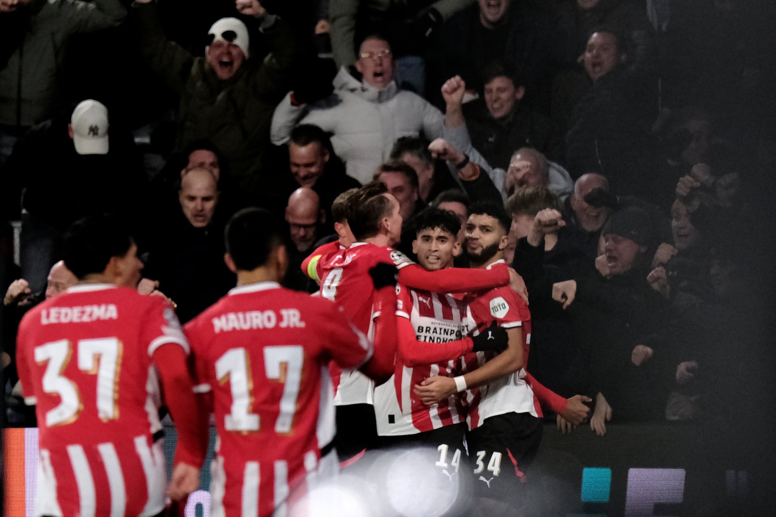 PSV's Ricardo Pepi, center, celebrates after scoring his sides third goal during the Champions League opening phase soccer match between PSV Eindhoven and Shakhtar Donetsk at the PSV Stadium in Eindhoven, Netherlands, Wednesday, Nov. 27, 2024. (AP Photo/Patrick Post)