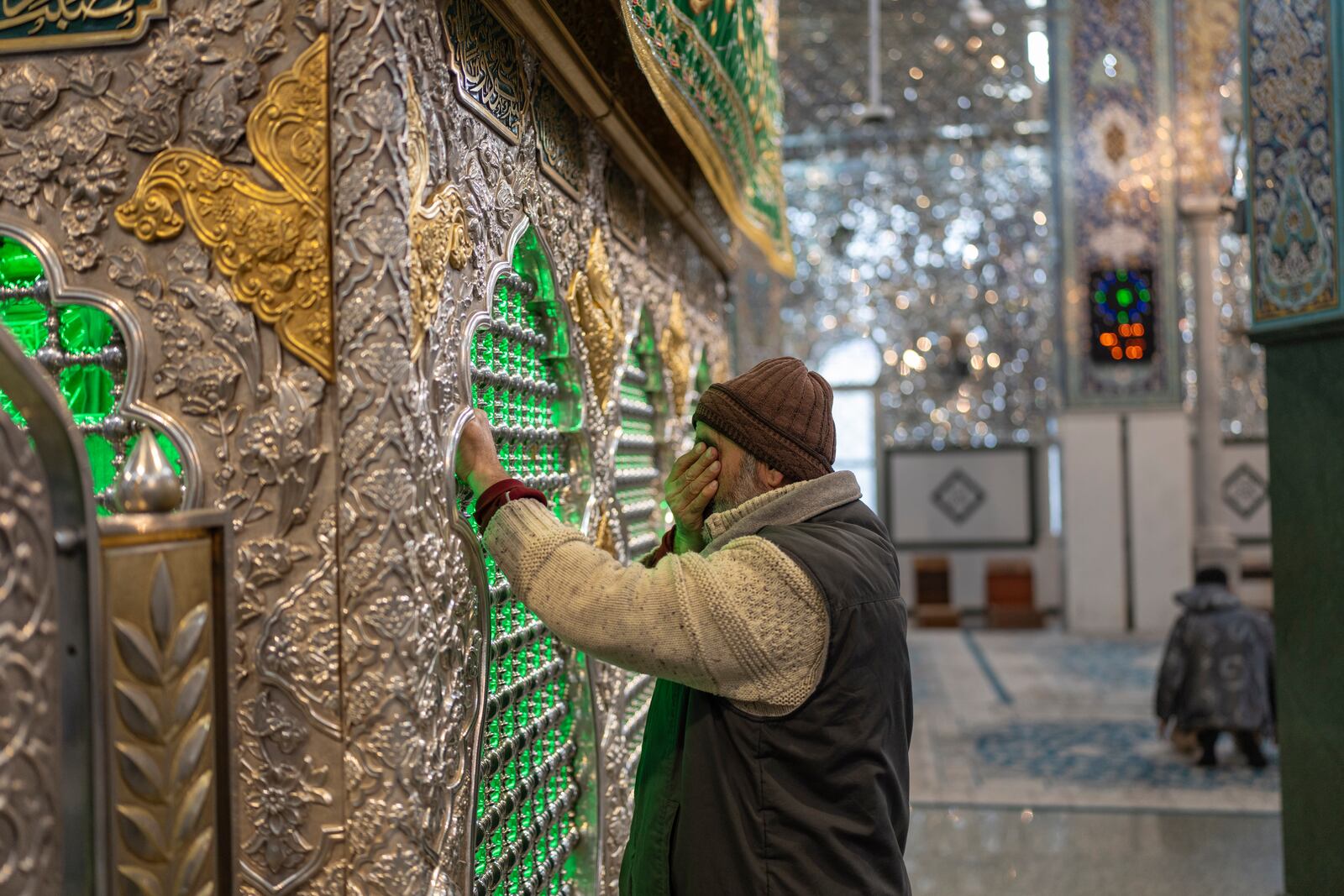 A man prays at the shrine of Sayyida Zaynab, the granddaughter of Prophet Mohammad, in Damascus, Syria, Saturday, Jan. 11, 2025. (AP Photo/Mosa'ab Elshamy)