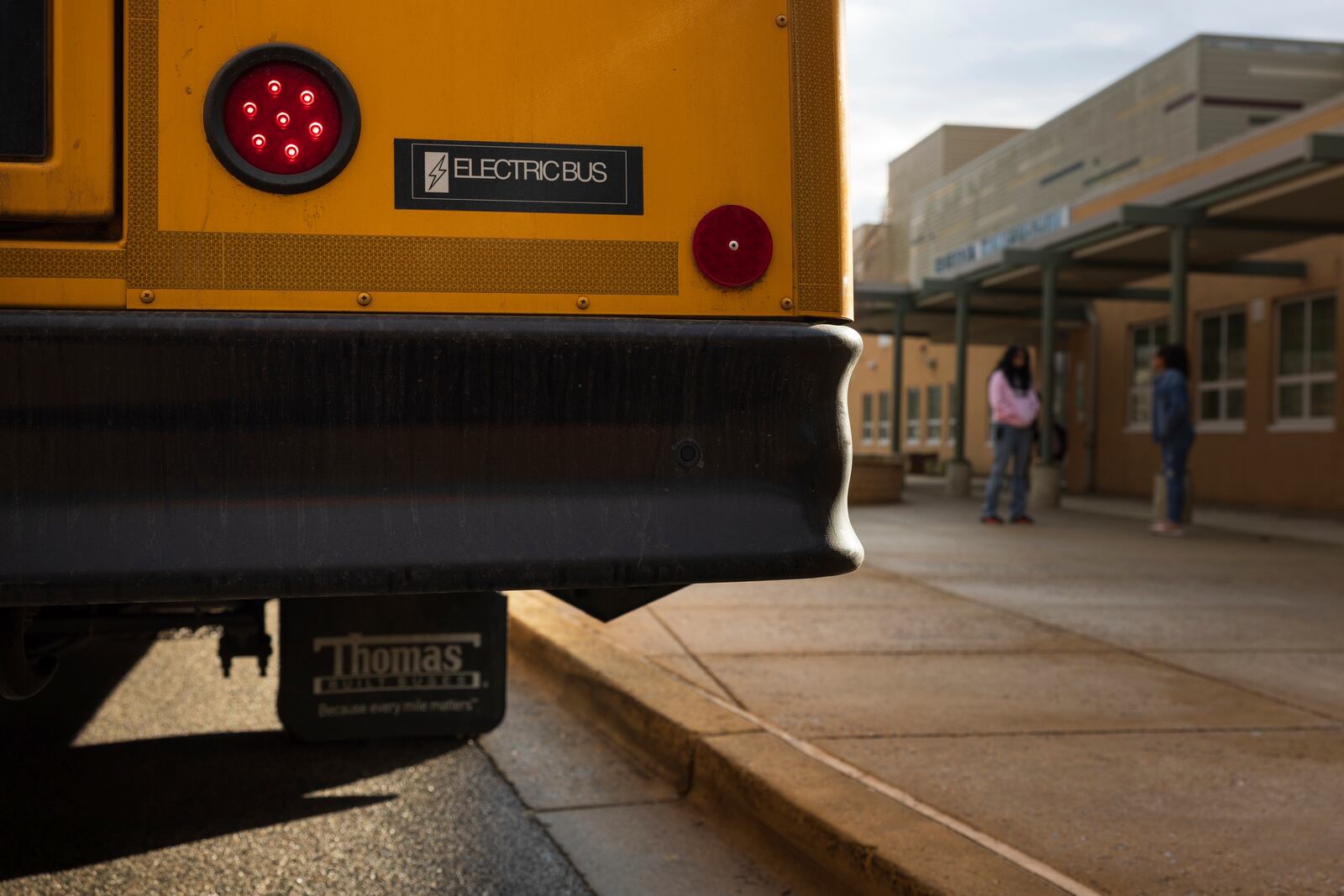 FILE - An electric school bus sits outside Rock Creek Forest Elementary School, Feb. 2, 2024, in Chevy Chase, Md. (AP Photo/Tom Brenner, File)