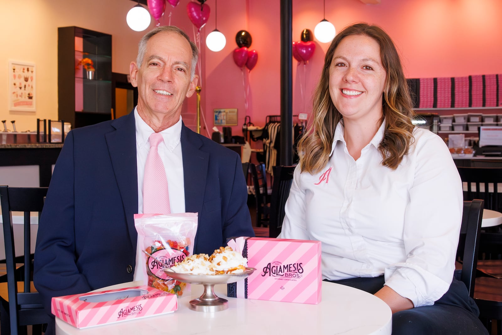 Randy Young, left, sits with his daughter Kristi Weissman inside their new Aglamesis Bros. Ice Cream & Chocolates location at corner of Main Street and D Street Wednesday, Oct. 9, 2024, in Hamilton. This is the first new location 54 years. NICK GRAHAM/STAFF