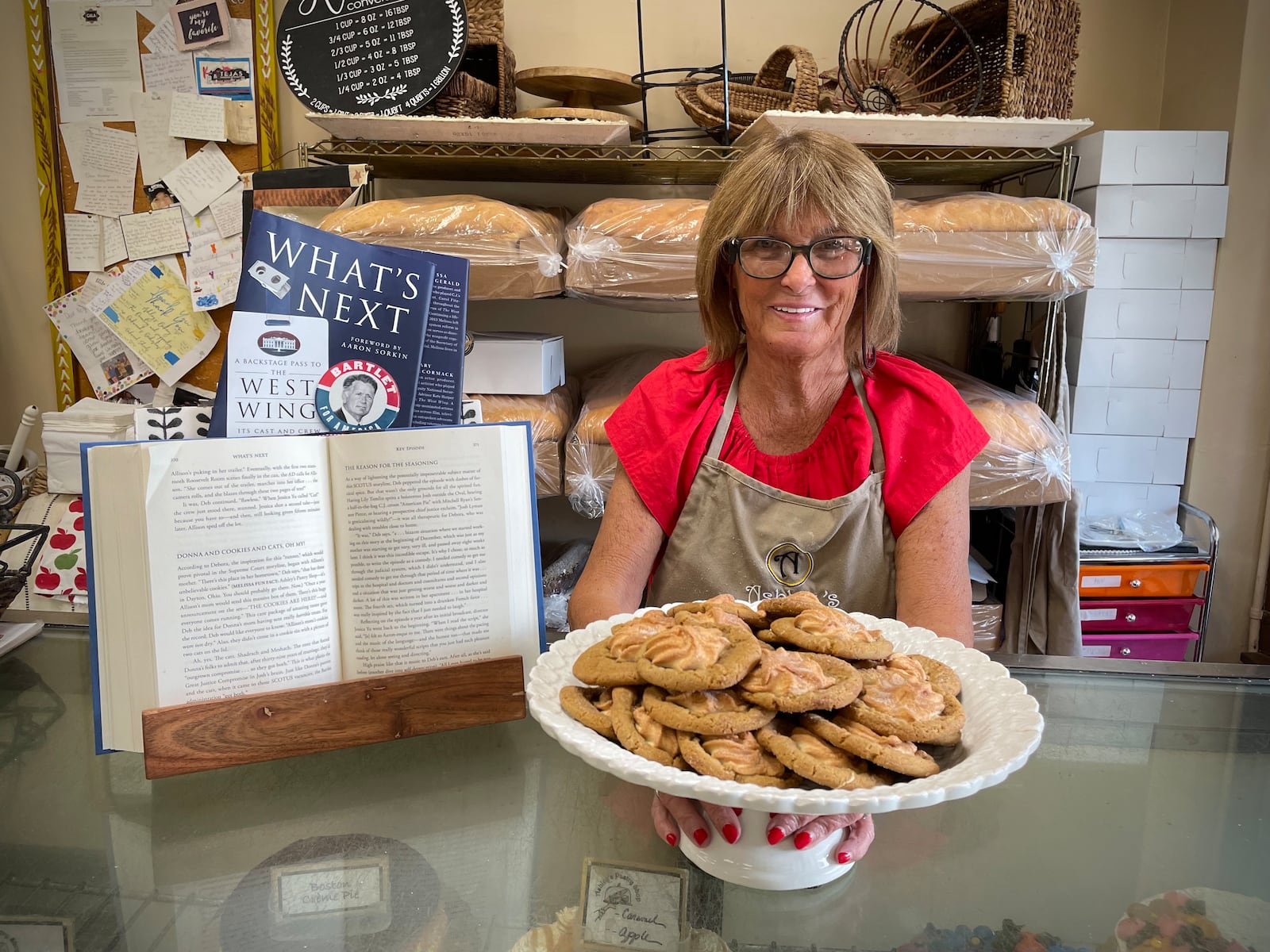 In the new book, “What’s Next: A Backstage Pass to The West Wing, Its Cast and Crew, and Its Enduring Legacy of Service” cast members Melissa Fitzgerald and Mary McCormack talk about the Sand Tarts and the connection to the show. Pictured is Ashley's Pastry Shop owner Theresa Hammons. NATALIE JONES/STAFF