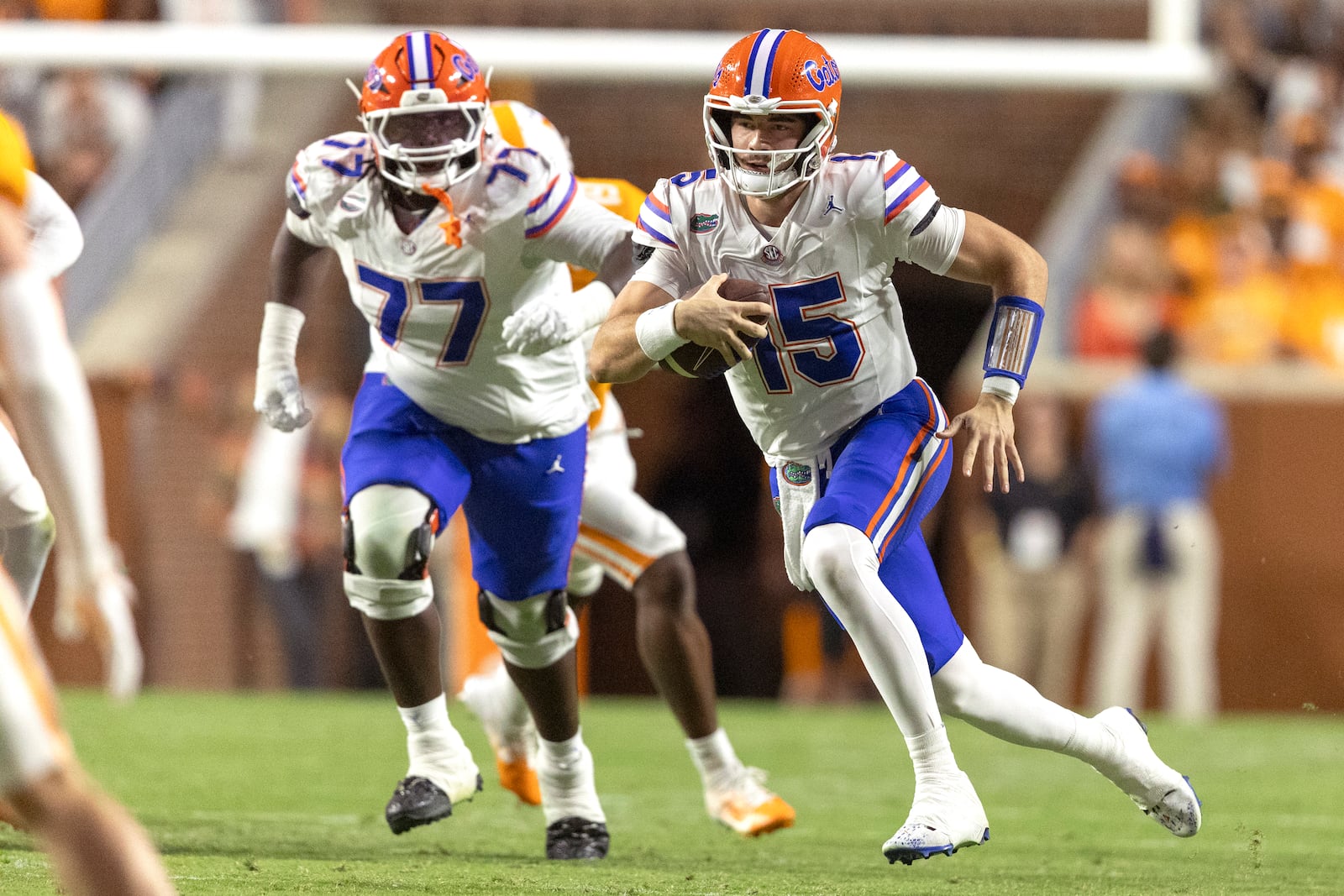 Florida quarterback Graham Mertz (15) runs for yardage during the first half of an NCAA college football game against Tennessee, Saturday, Oct. 12, 2024, in Knoxville, Tenn. (AP Photo/Wade Payne)