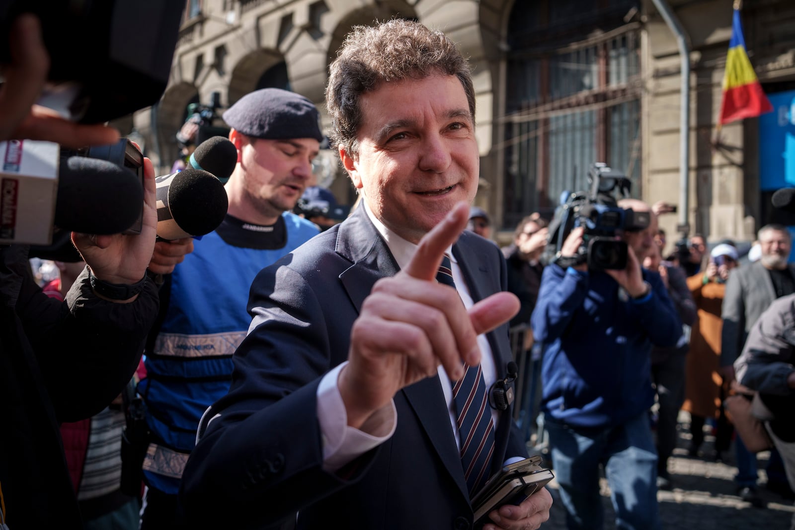 Nicusor Dan, the mayor of Bucharest, speaks to media before registering his bid for the country's presidency, outside Romania's Electoral Authority, in Bucharest, Romania, Friday, March 7, 2025. (AP Photo/Vadim Ghirda)