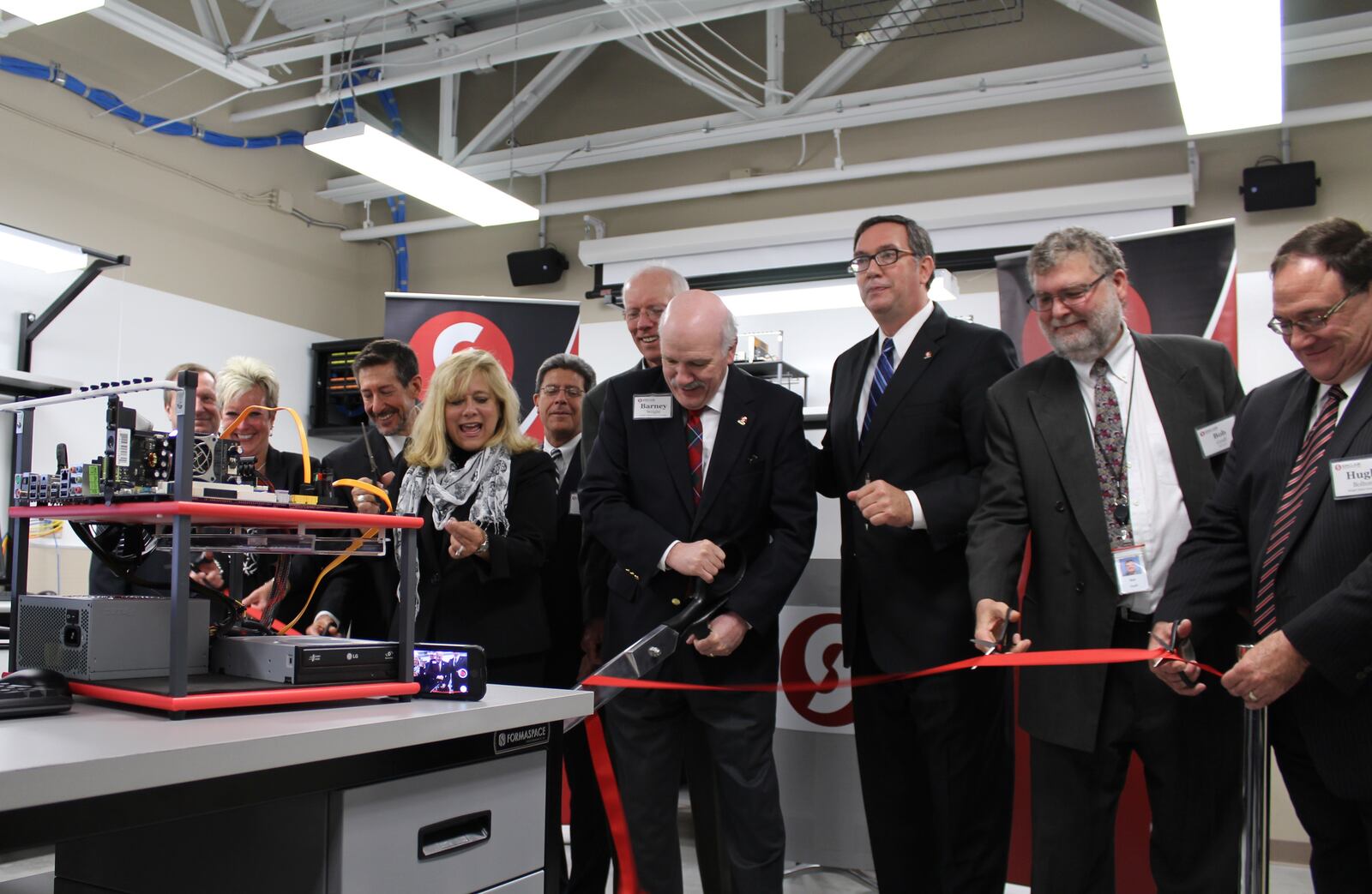 Sinclair and industry leaders cut the ribbon opening the Corporate Campus at Austin Landing.