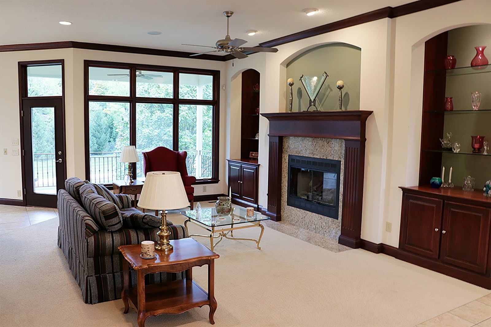 Within the great room, a gas fireplace has cherry wood surround and mantel and is flanked by display nooks with glass shelves, cabinets and lights. Main social areas are open to each other with inlay carpet designating spots for dining and relaxing near the fireplace. CONTRIBUTED PHOTO BY KATHY TYLER