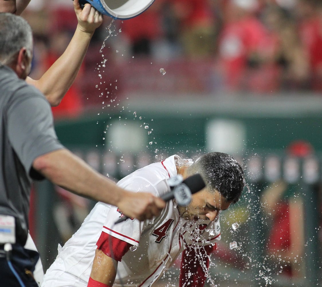 Photos: Reds beat Brewers on wild play in 11th