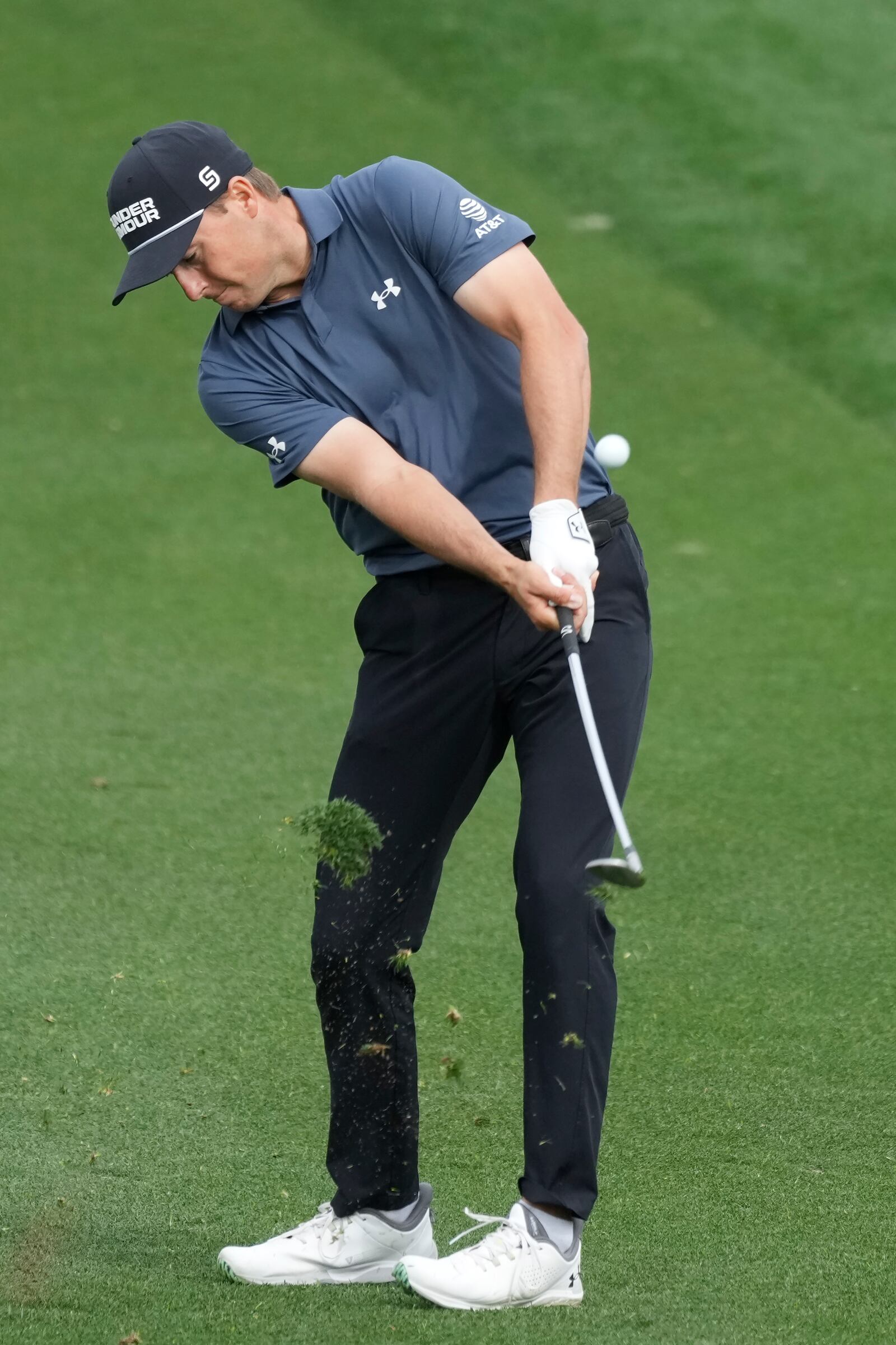 Jordan Spieth hits his approach shot at the second hole during the final round of the Phoenix Open golf tournament at TPC Scottsdale Sunday, Feb. 9, 2025, in Scottsdale, Ariz. (AP Photo/Ross D. Franklin)