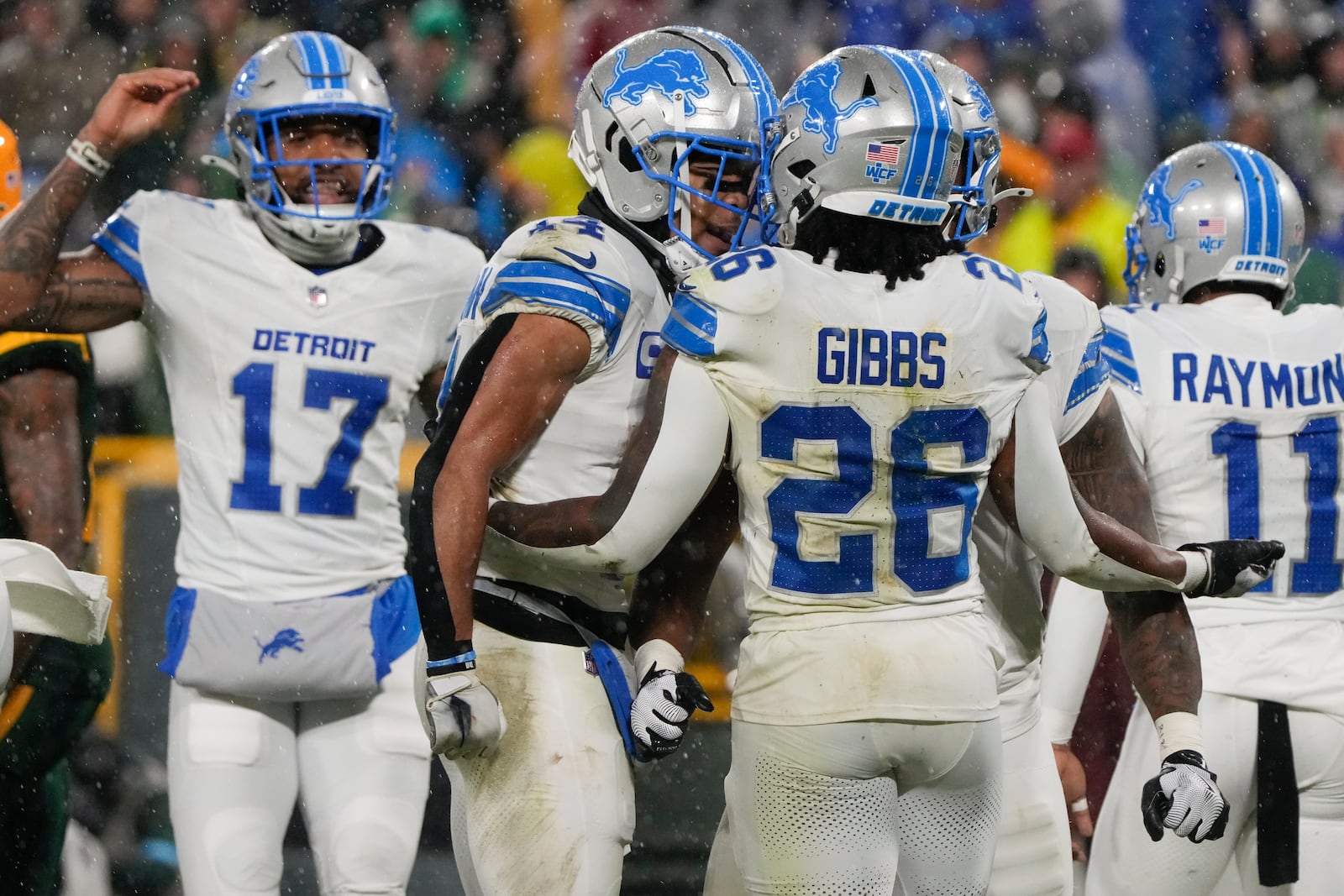 Detroit Lions running back Jahmyr Gibbs (26) celebrates his rushing touchdown with teammates during the second half of an NFL football game against the Green Bay Packers, Sunday, Nov. 3, 2024, in Green Bay, Wis. (AP Photo/Morry Gash)