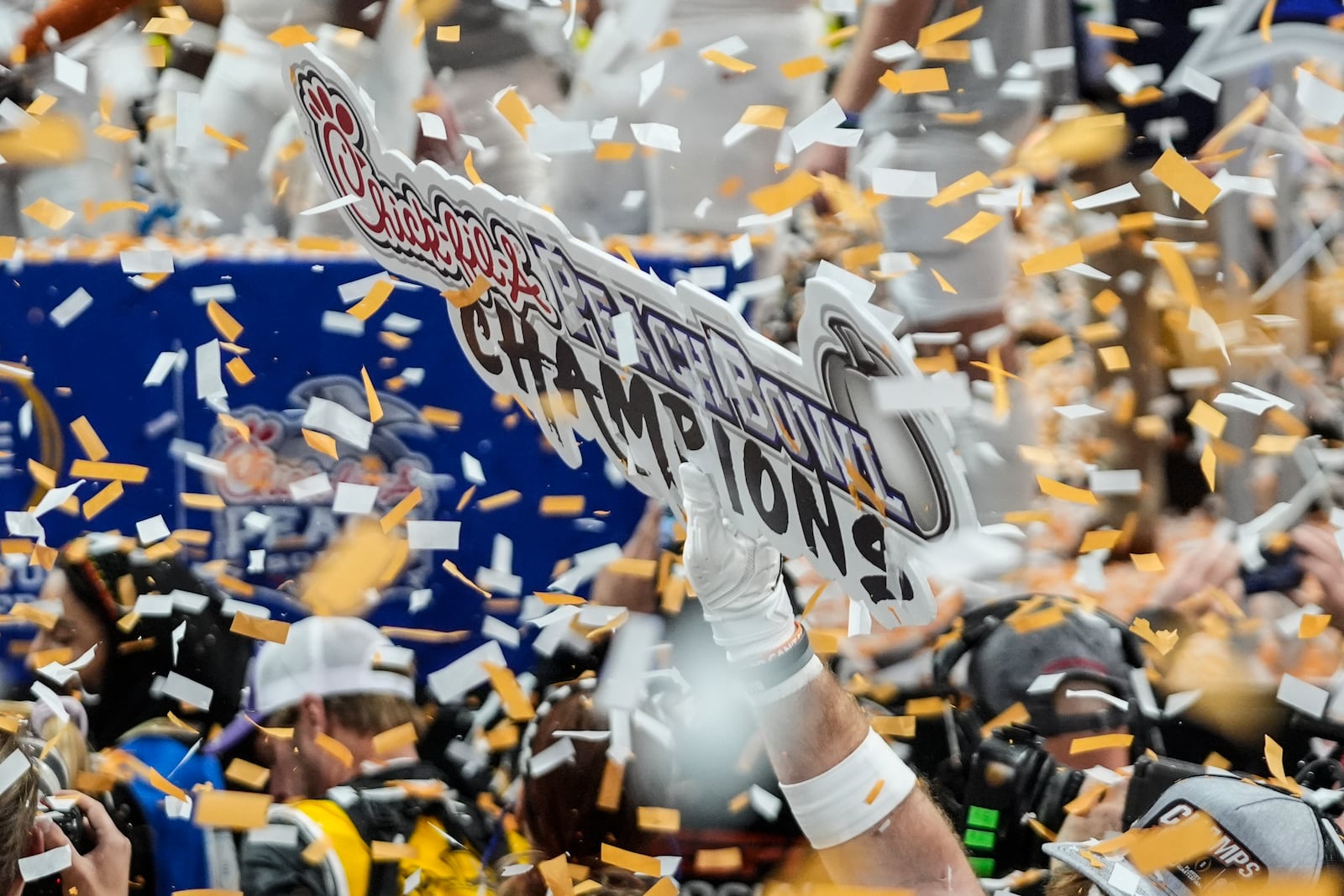 Texas players celebrate victory after a quarterfinals College Football Playoff game against Arizona State, Wednesday, Jan. 1, 2025, in Atlanta. Texas won 39-31 in two overtime periods. (AP Photo/John Bazemore)