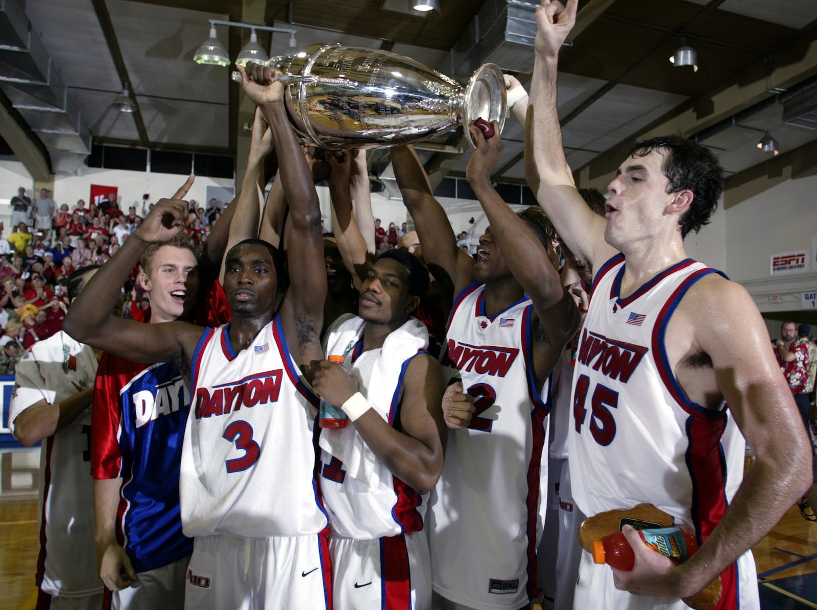 Dayton players, from left to right, Greg Kohls, Ramad Marshall, Warren Williams, Frank Iguodala and Keith Waleskowski celebrates with the championship trophy after defeating Hawaii 82-72 in the championship game at the Maui Invitational in Lahaina, Hawaii Wednesday, Nov. 26, 2003.   (AP Photo/Michael Conroy)