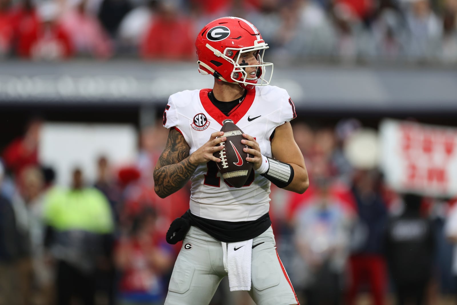 Georgia quarterback Carson Beck (15) looks to throw the ball during the first half of an NCAA college football game against Mississippi on Saturday, Nov. 9, 2024, in Oxford, Miss. (AP Photo/Randy J. Williams)