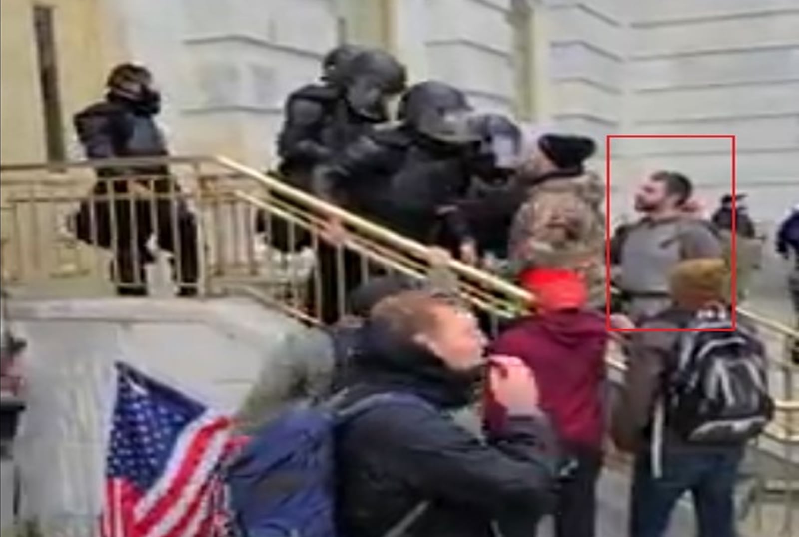 In this photo from a federal court affidavit, investigators said Dean Robert Harshman is seen in the crowd outside the U.S. Capitol on Jan. 6, 2021