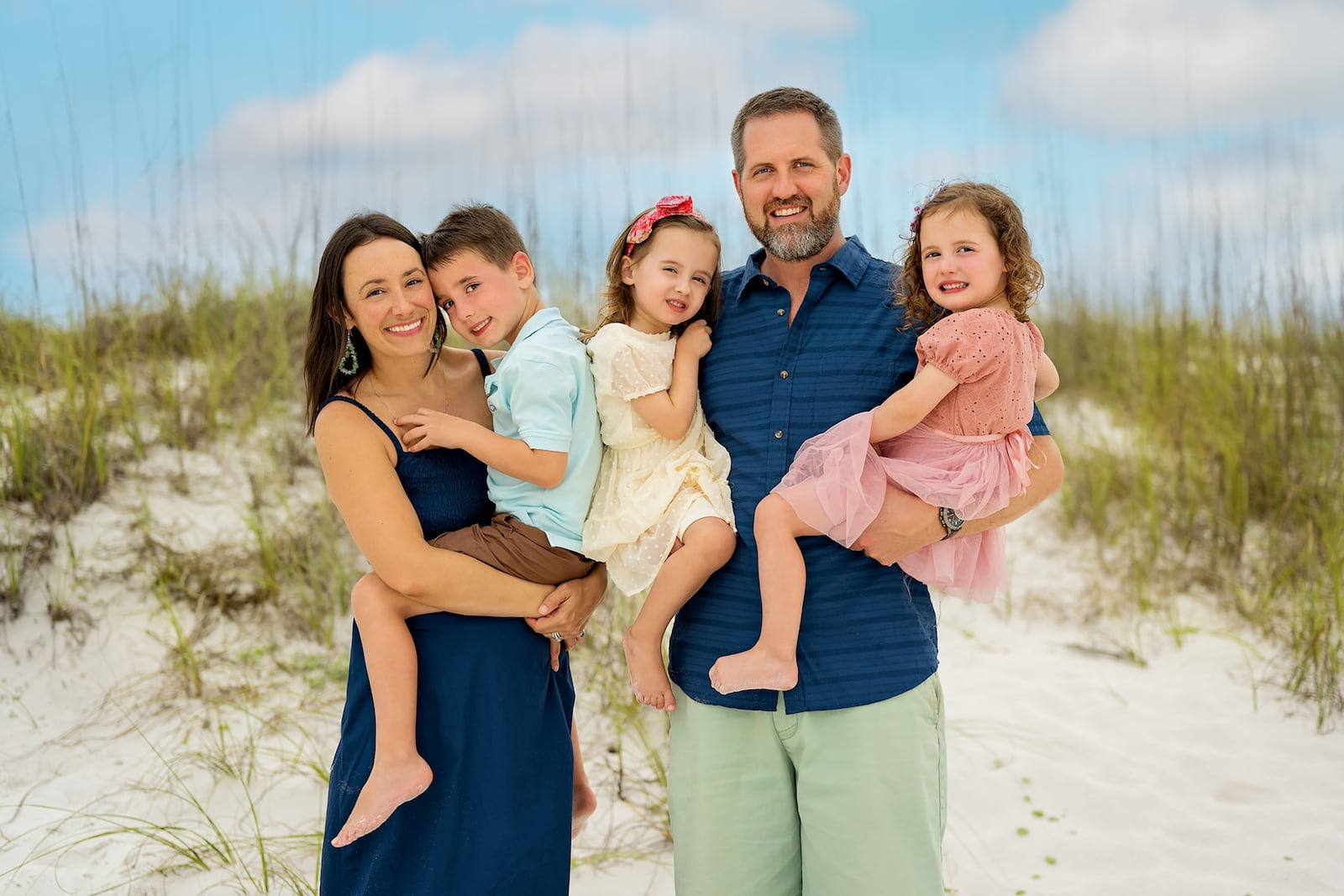 Jack Brendamour (right) with his family, including wife Julianne, a Wayne High School graduate (left), holding Jaxson, then 6. Brendamour holds twins Julia and Jordyn (then 3), born within a few months of McCreary's passing.