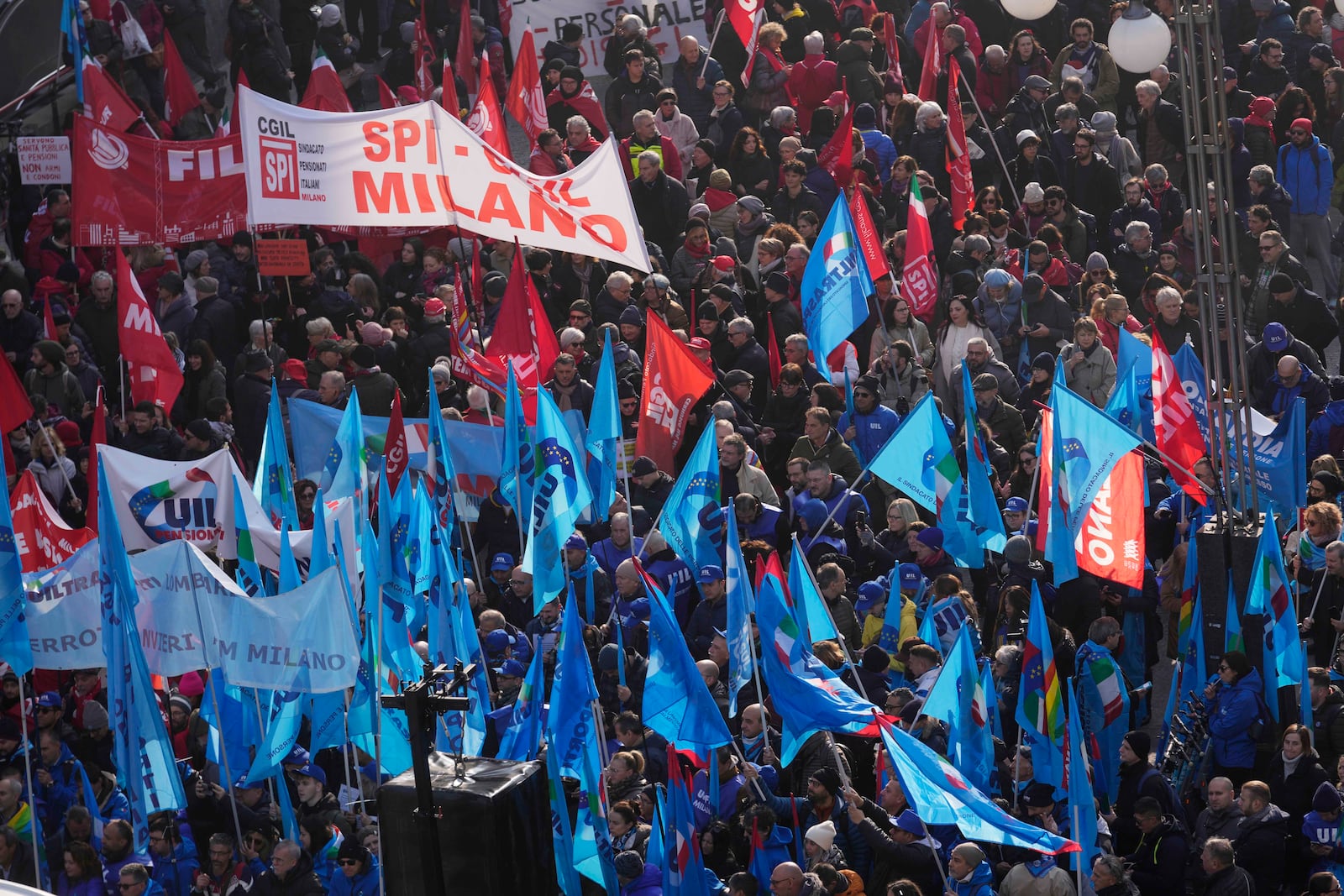 FILE - Demonstrators gather during a public and private sectors' national strike called by the labor unions to protest against the government's budget law in Milan, Italy, Nov. 29, 2024. (AP Photo/Luca Bruno, File)