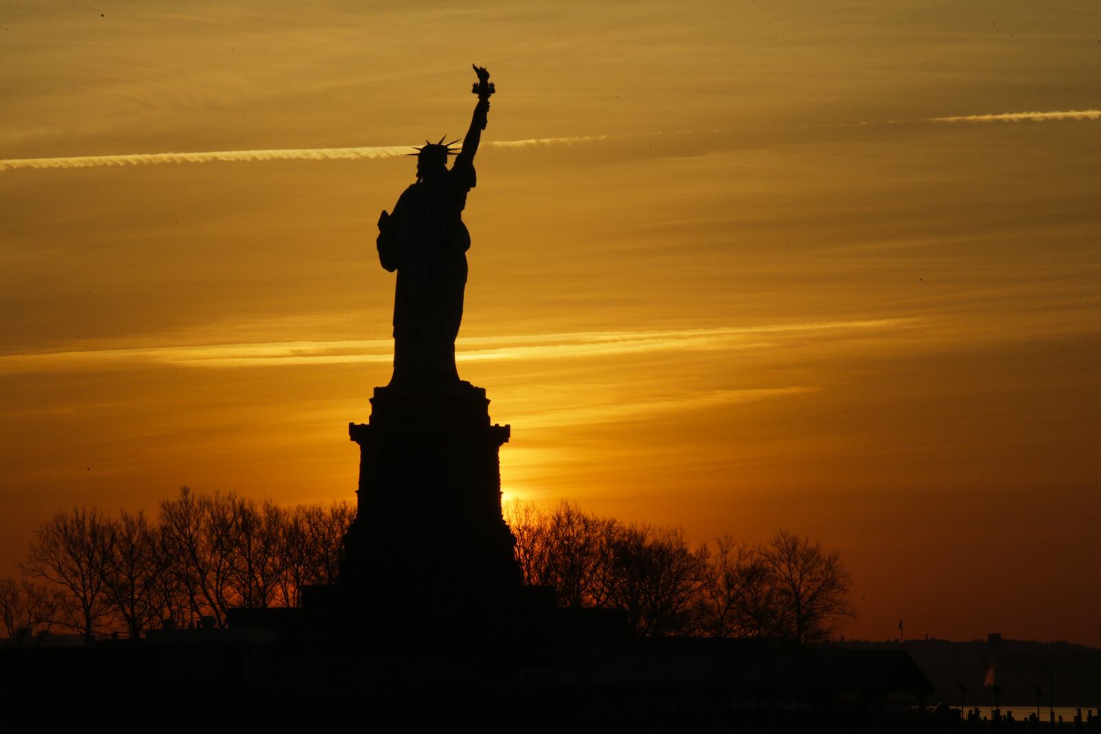 The Statue of Liberty is pictured from Liberty State Park on January 21, 2018 in Jersey City, New Jersey. The iconic landmark was closed yesterday as part of the US government shutdown now entering its second full day after coming into effect at midnight on Friday after senators failed to pass a new federal spending bill. (Photo by Eduardo Munoz Alvarez/Getty Images)