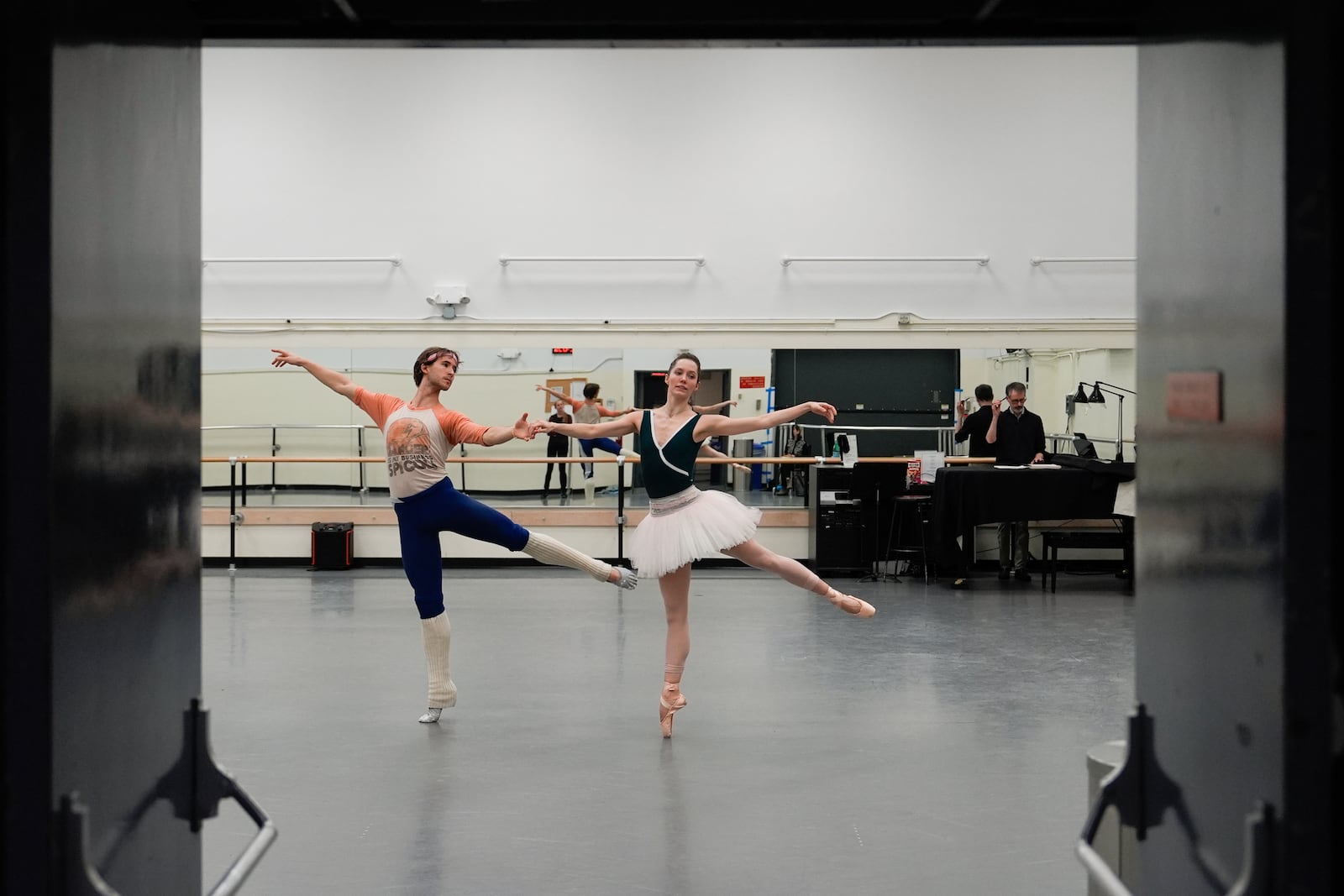 Unity Phelan, center, and Joseph Gordon, left, rehearse for New York City Ballet's "Swan Lake," Tuesday, Feb. 25, 2025, in New York. (AP Photo/Julia Demaree Nikhinson)