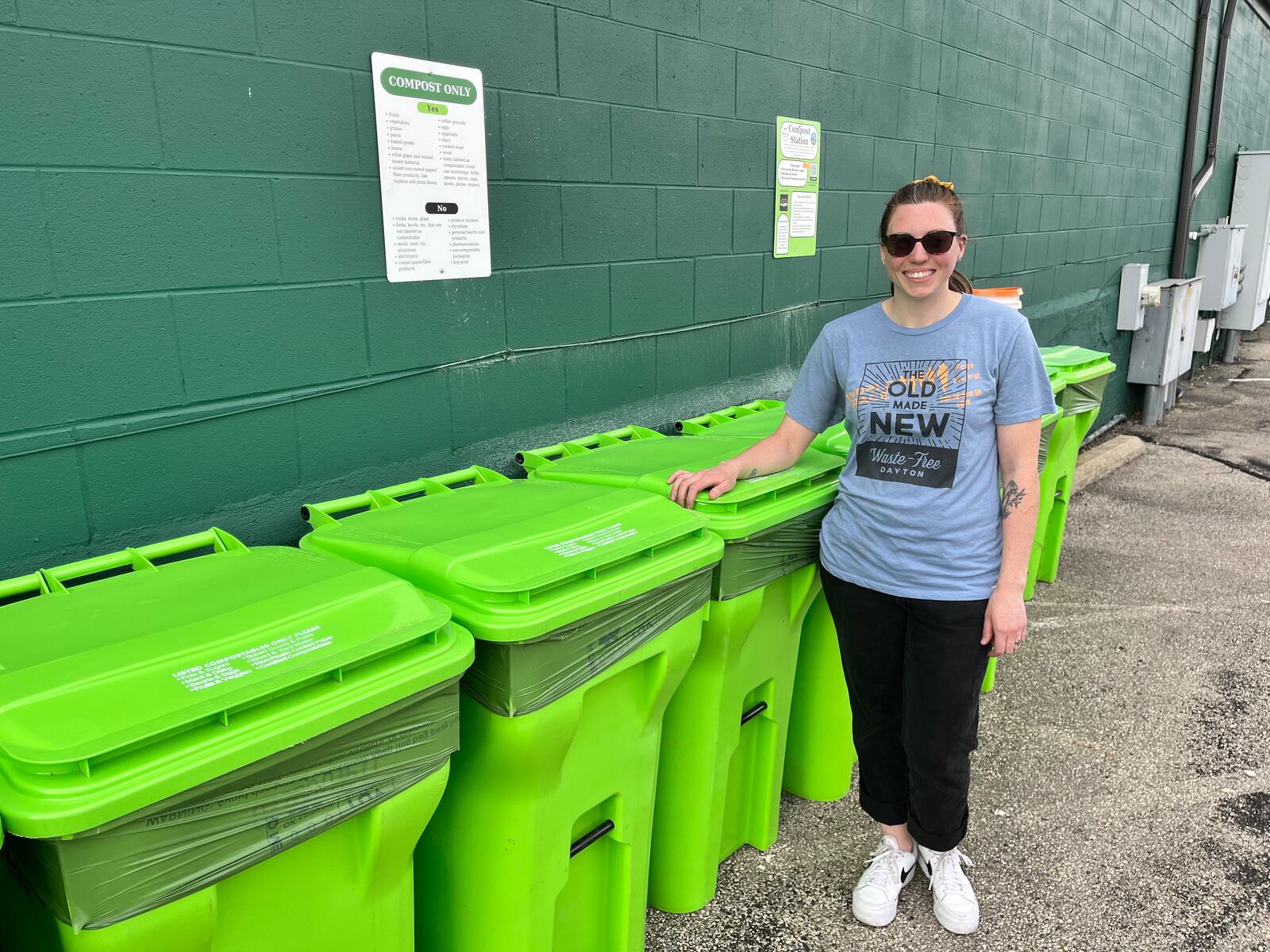 Waste-Free Dayton has teamed up with 2nd Street Market to offer a free, community compost station located on the backside of the market near Webster Street. Pictured is Natalie Warrick, founder and co-executive director of Waste-Free Dayton. NATALIE JONES/STAFF