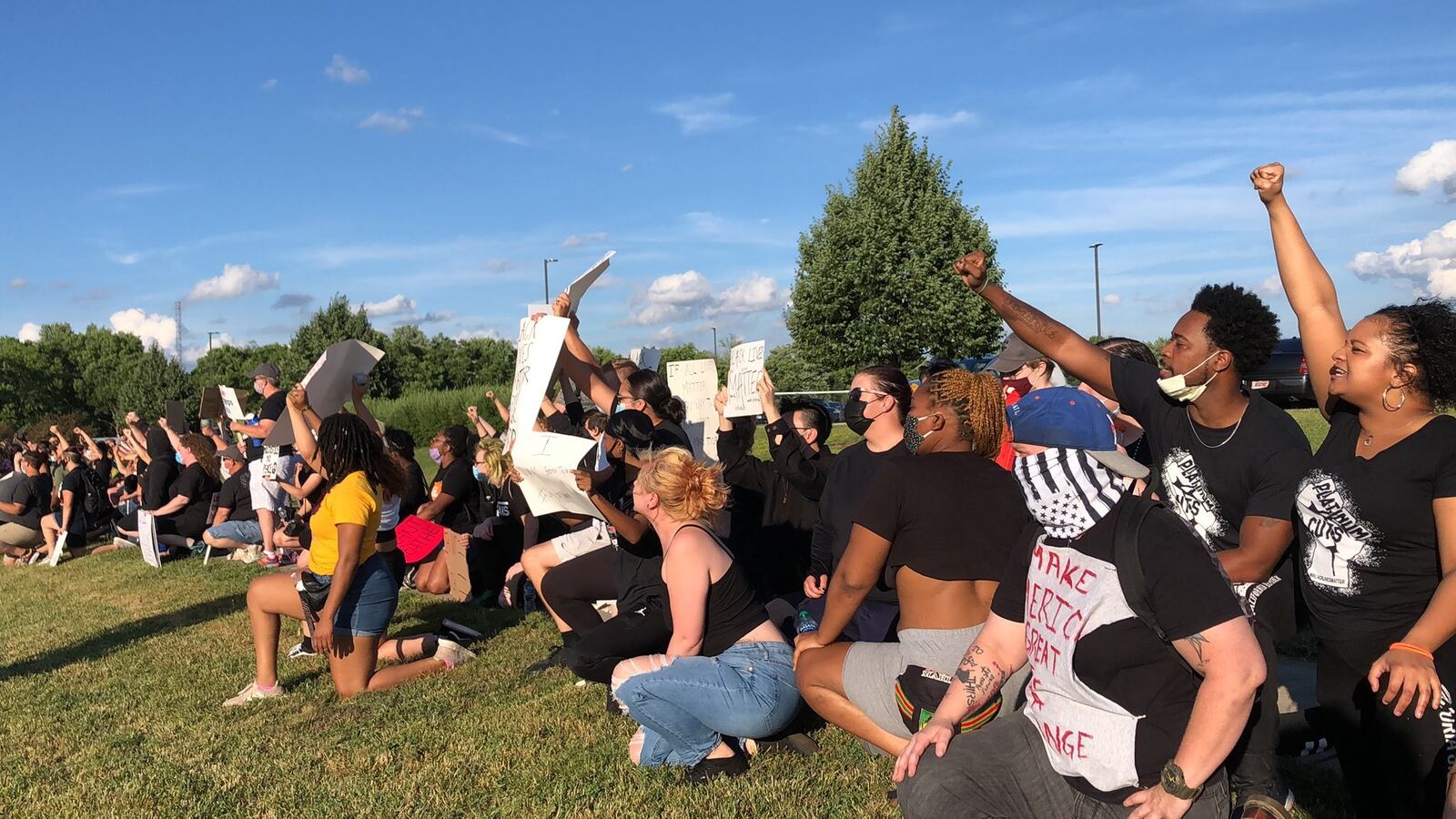 Protesters who gathered in Riverside took a knee before a small group of counter-protesters, including some people who yelled racial slurs, on Tuesday evening, June 23, 2020. BONNIE MEIBERS / STAFF