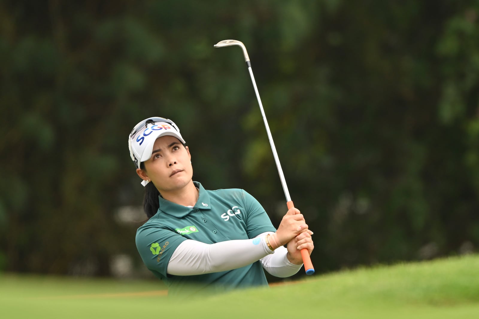 Moriya Jutanugarn of Thailand watches her shot on the 17th hole during the first round of the LPGA Honda Thailand golf tournament in Pattaya, southern Thailand, Thursday, Feb. 20, 2025. (AP Photo/Kittinun Rodsupan)