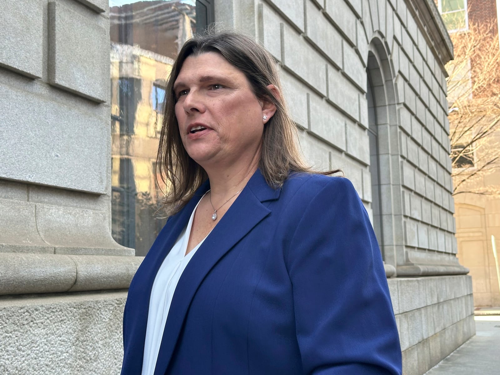 Anna Lange speaks to reporters on Tuesday, Feb. 4, 2025 in Atlanta after a federal appeals court hearing in which Houston County, Georgia, sought to overturn an order to pay for Lange's gender affirming care. (AP Photo/Jeff Amy)