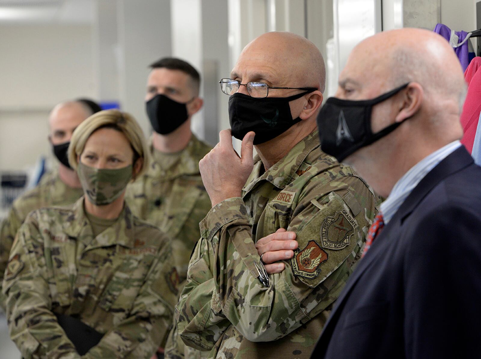 Acting Secretary of the Air Force John Roth, right, and Gen. Arnold W. Bunch Jr., commander, Air Force Materiel Command, listen to a presentation about the U.S. Air Force School of Aerospace Medicine Epidemiology Laboratory at Wright-Patterson Air Force Base, Ohio, March 23, 2021.  The lab is responsible for analyzing a majority of the COVID-19 tests in the Air Force. Roth met with Air Force personnel and toured several facilities at the base including the National Air and Space Intelligence Center. U.S. AIR FORCE PHOTO/TY GREENLEES