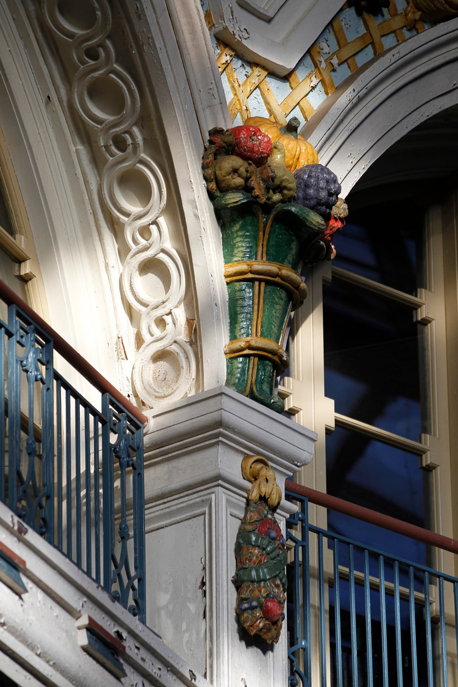 Architectural details like this colorful cornucopia fill the rotunda of the Dayton Arcade.  LISA POWELL / STAFF