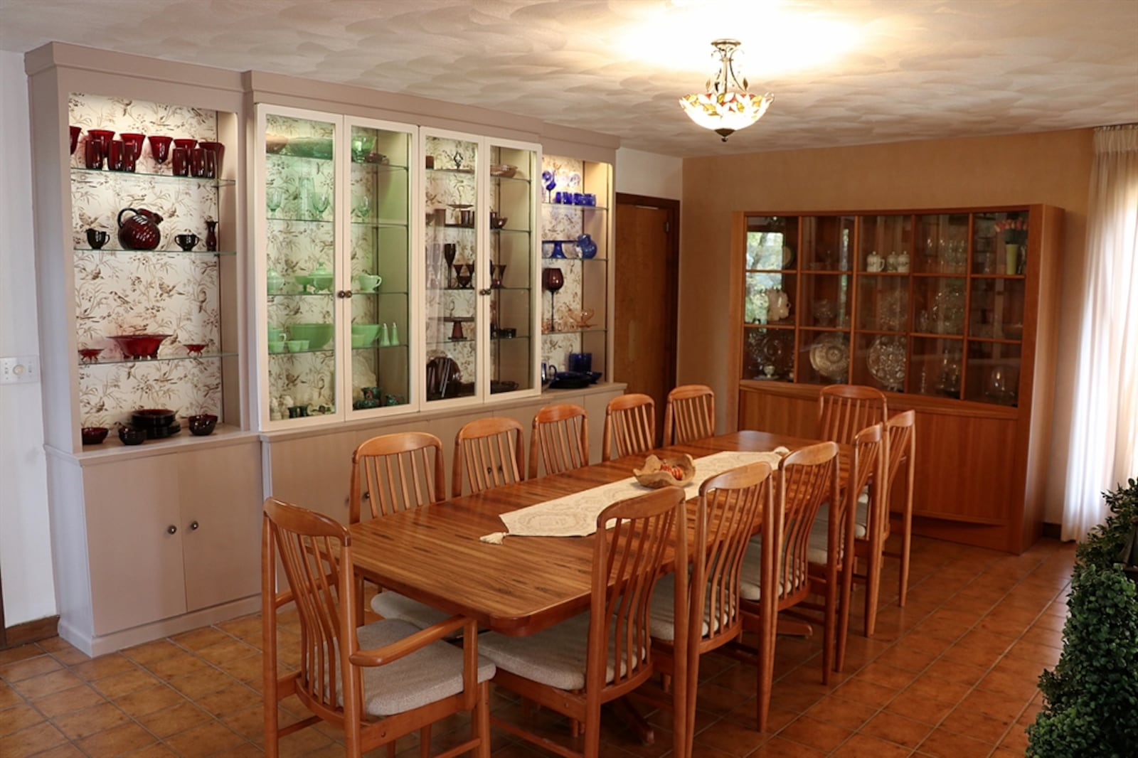 The longest wall of the dining room has a built-in china buffet with lighted glass display cabinet and cabinet storage. Contributed photo