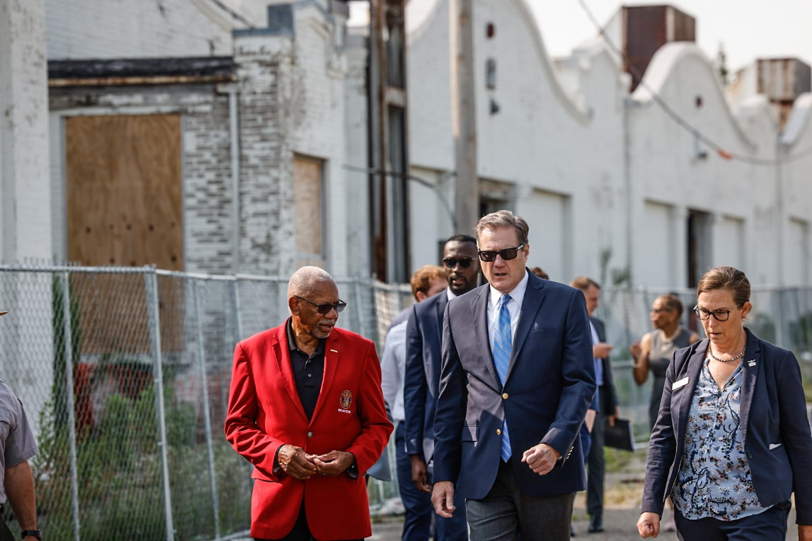 From left, Dayton Mayor Jeffrey Mims Jr., U.S. Rep. Mike Turner and Executive Director of the National Aviation Heritage Area Mackensie Wittmer go on a walking tour of the Wright Factory on West Third Street Tuesday August 1, 2023. JIM NOELKER/STAFF