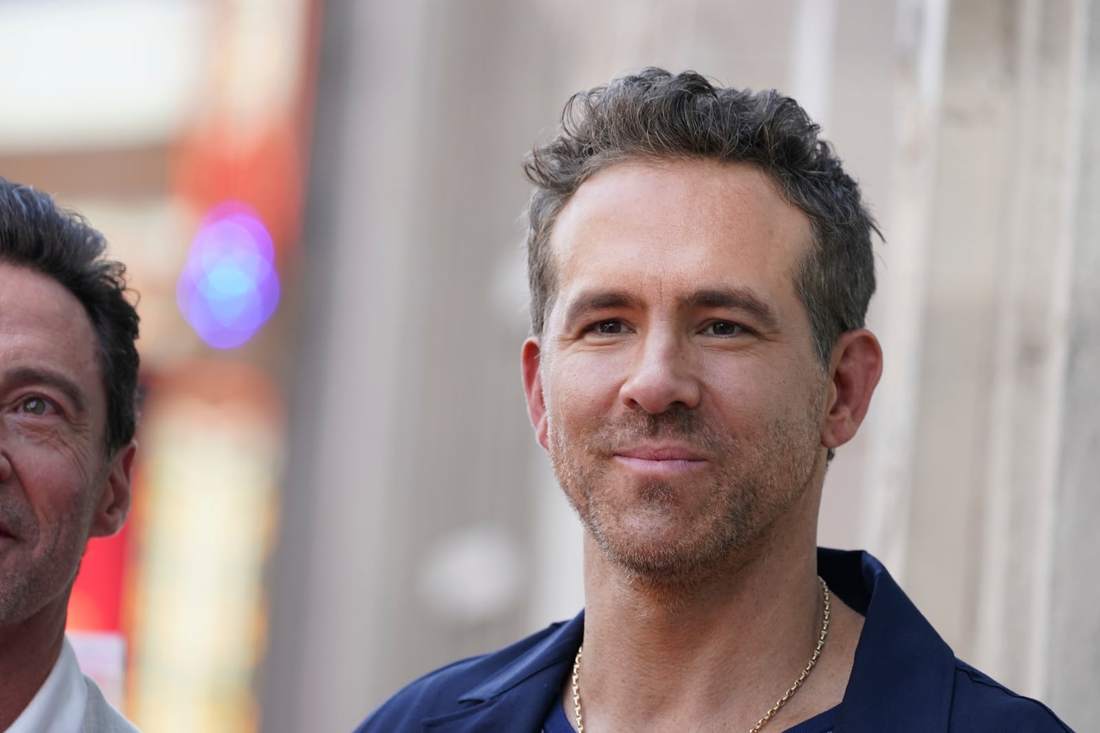 FILE - Ryan Reynolds attends a ceremony honoring Kevin Feige with a star on the Hollywood Walk of Walk of Fame, July 25, 2024, in Los Angeles. (Photo by Jordan Strauss/Invision/AP, File)