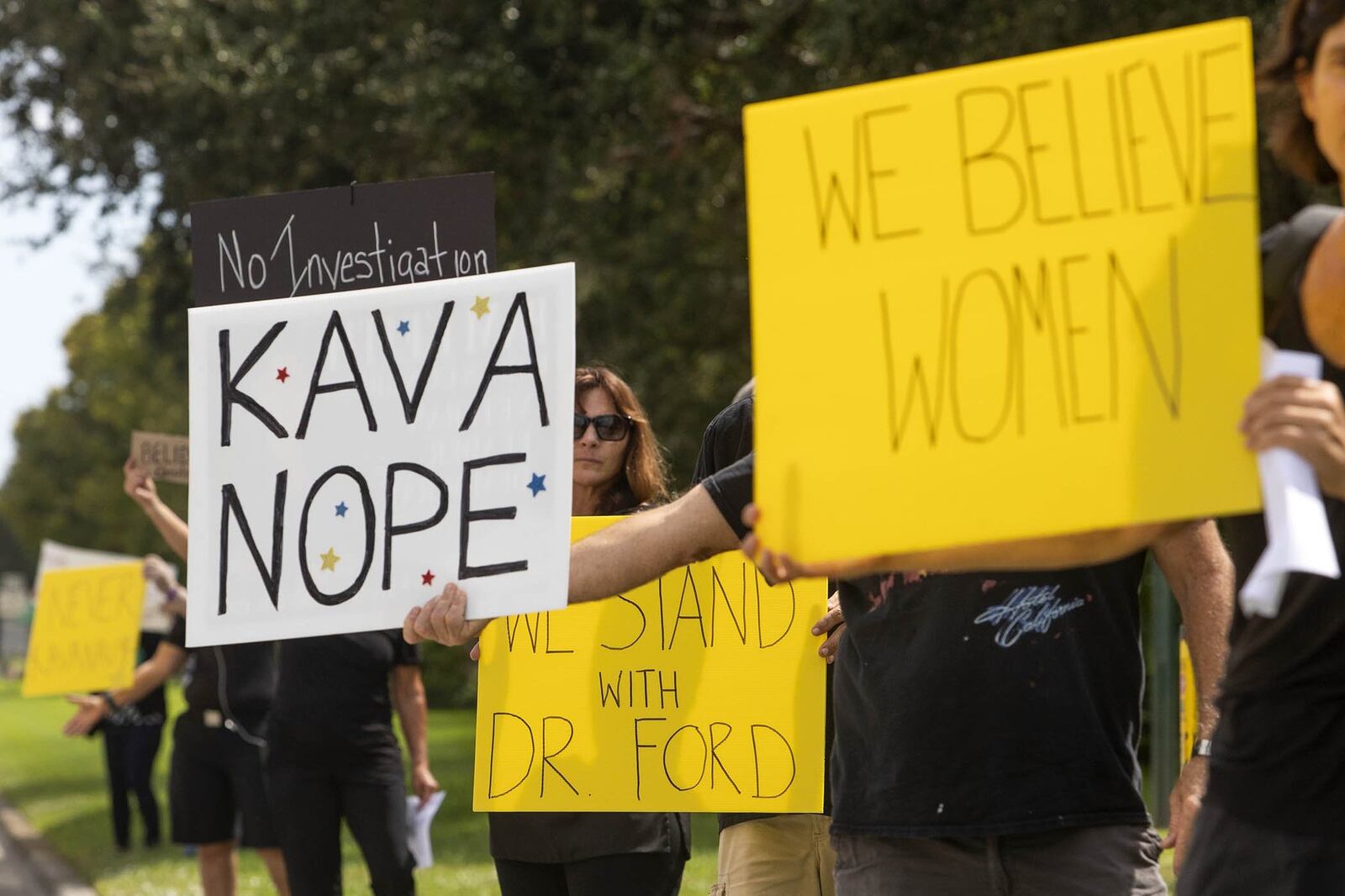 Men and women hold signs protesting the nomination of Brett Kavanaugh for supreme court outside Sen. Marco Rubio’s office on PGA Boulevard in Palm Beach Gardens Thursday, September 27, 2018. On Wednesday, Dr. Christine Blasey Ford, who accused Kavanaugh of sexually assaulting her in high school, appeared before the Senate in a highly-publicized hearing. Two other women have since accused Kavanaugh of sexual assault since Dr. Ford went public with her accusation. (James Wooldridge / The Palm Beach Post)