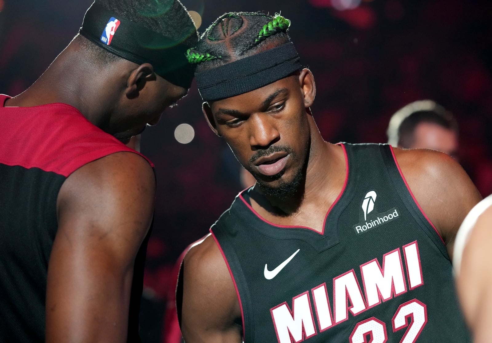 Miami Heat forward Jimmy Butler (22) and center Bam Adebayo, left, are introduced before an NBA basketball game against the Indiana Pacers Thursday, Jan. 2, 2025, in Miami. (AP Photo/Lynne Sladky)