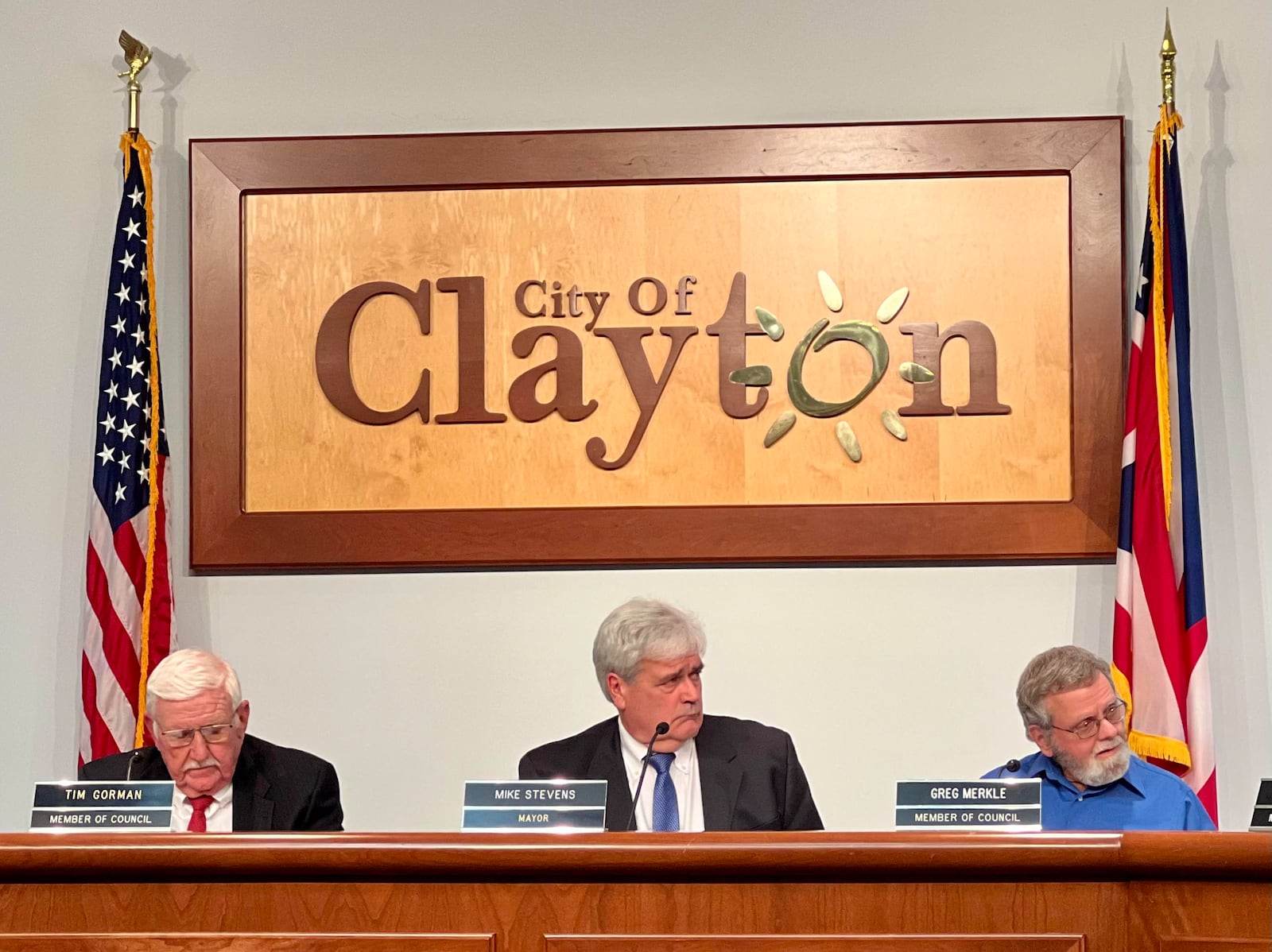 Clayton Mayor Mike Stevens, along with councilmen Tim Gorman and Greg Merkle, listen to fellow council members during a discussion about the necessity of a new income tax during a November 2023 meeting. AIMEE HANCOCK/STAFF