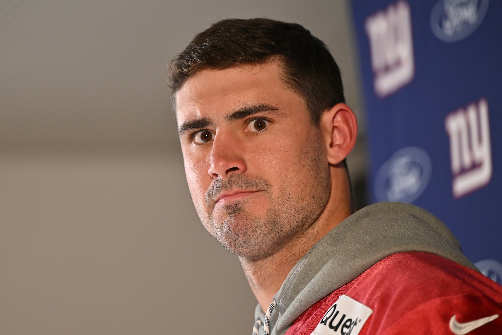 New York Giants quarterback Daniel Jones (8) attends a news conference after a practice session in Munich, Germany, Friday, Nov. 8, 2024. The New York Giants are set to play the Carolina Panthers in an NFL game at the Allianz Arena in Munich on Sunday. (AP Photo/Lennart Preiss)