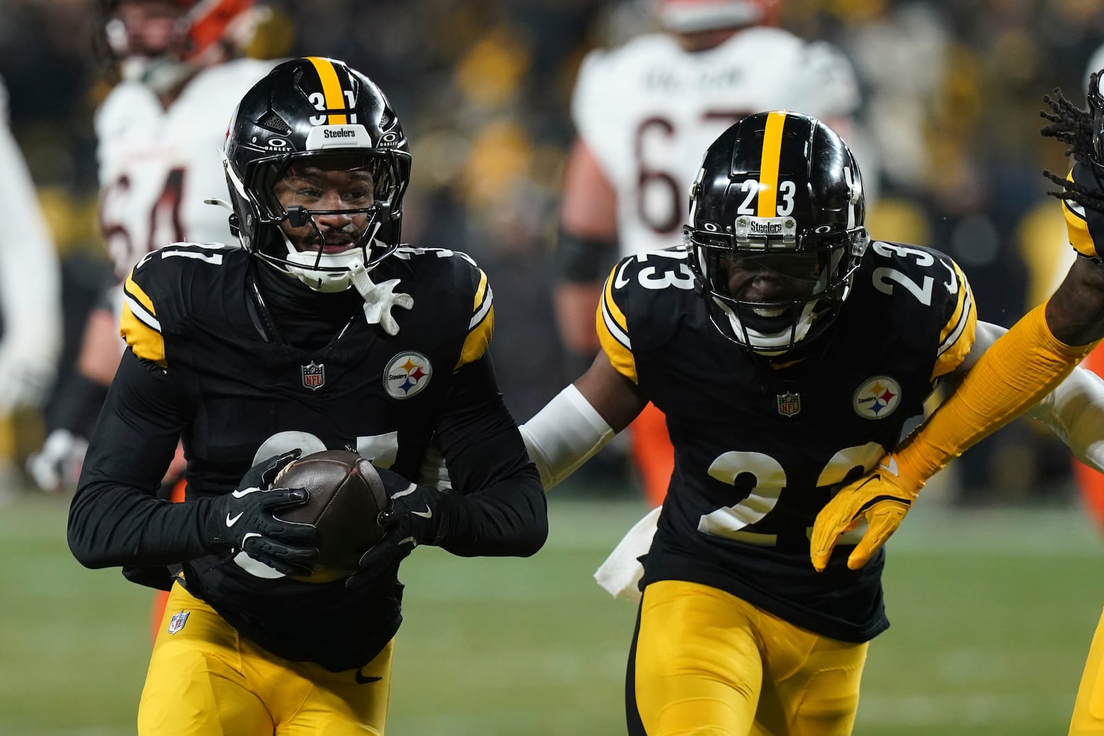 Pittsburgh Steelers cornerback Beanie Bishop Jr. (31) celebrates an interception with safety Damontae Kazee (23) during the first half of an NFL football game against the Cincinnati Bengals in Pittsburgh, Saturday, Jan. 4, 2025. (AP Photo/Matt Freed)