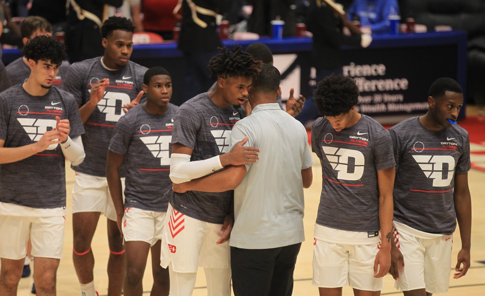 Dayton's DaRon Holmes II gets a hug from Ricardo Greer before a game against Cedarville in an exhibition game on Monday, Nov. 1, 2021, at UD Arena. David Jablonski/Staff