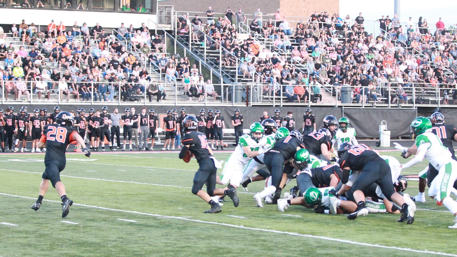 Beavercreek quarterback Calvin Svoboda keeps the ball against Northmont