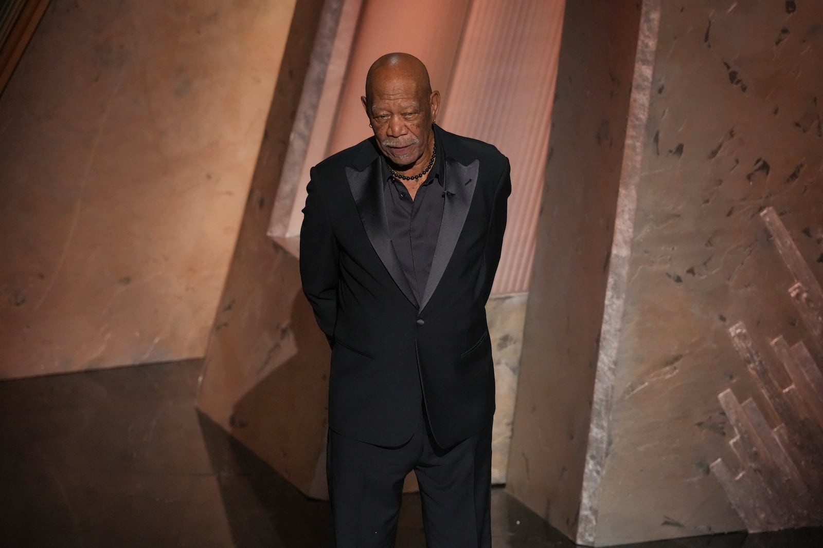 Morgan Freeman speaks about Gene Hackman during the Oscars on Sunday, March 2, 2025, at the Dolby Theatre in Los Angeles. (AP Photo/Chris Pizzello)