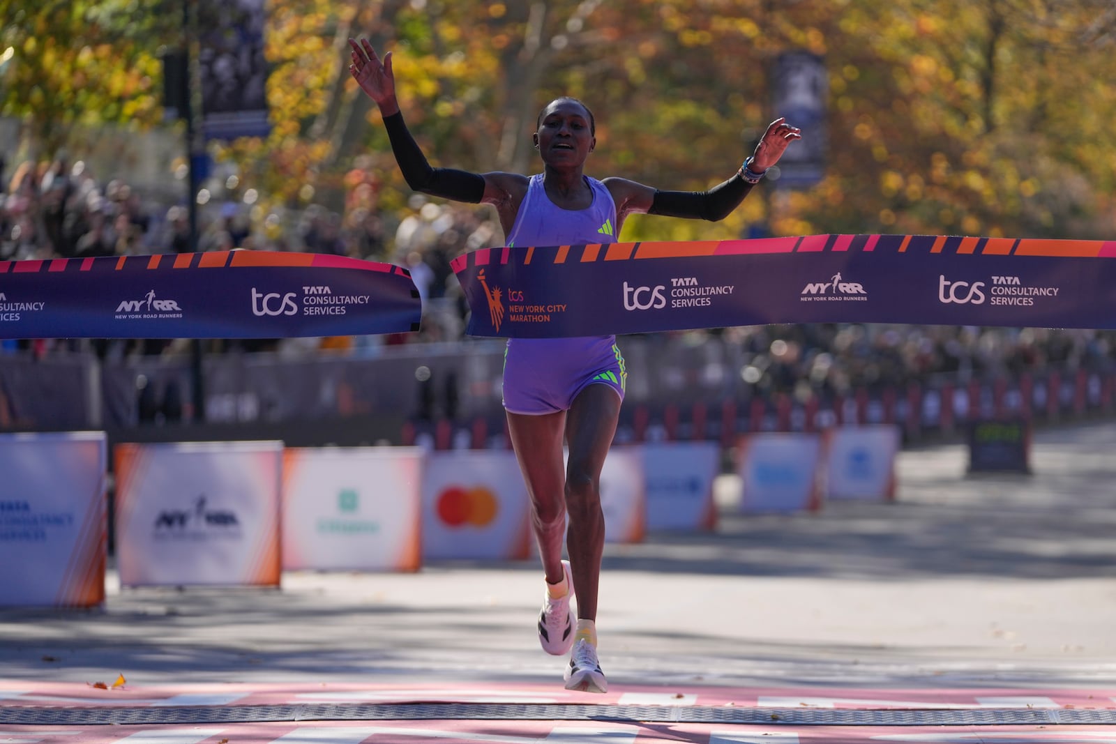 Kenya's Sheila Chepkirui crosses the finish line to win the women's division of the New York City Marathon, Sunday, Nov. 3, 2024, in New York. (AP Photo/Frank Franklin II)